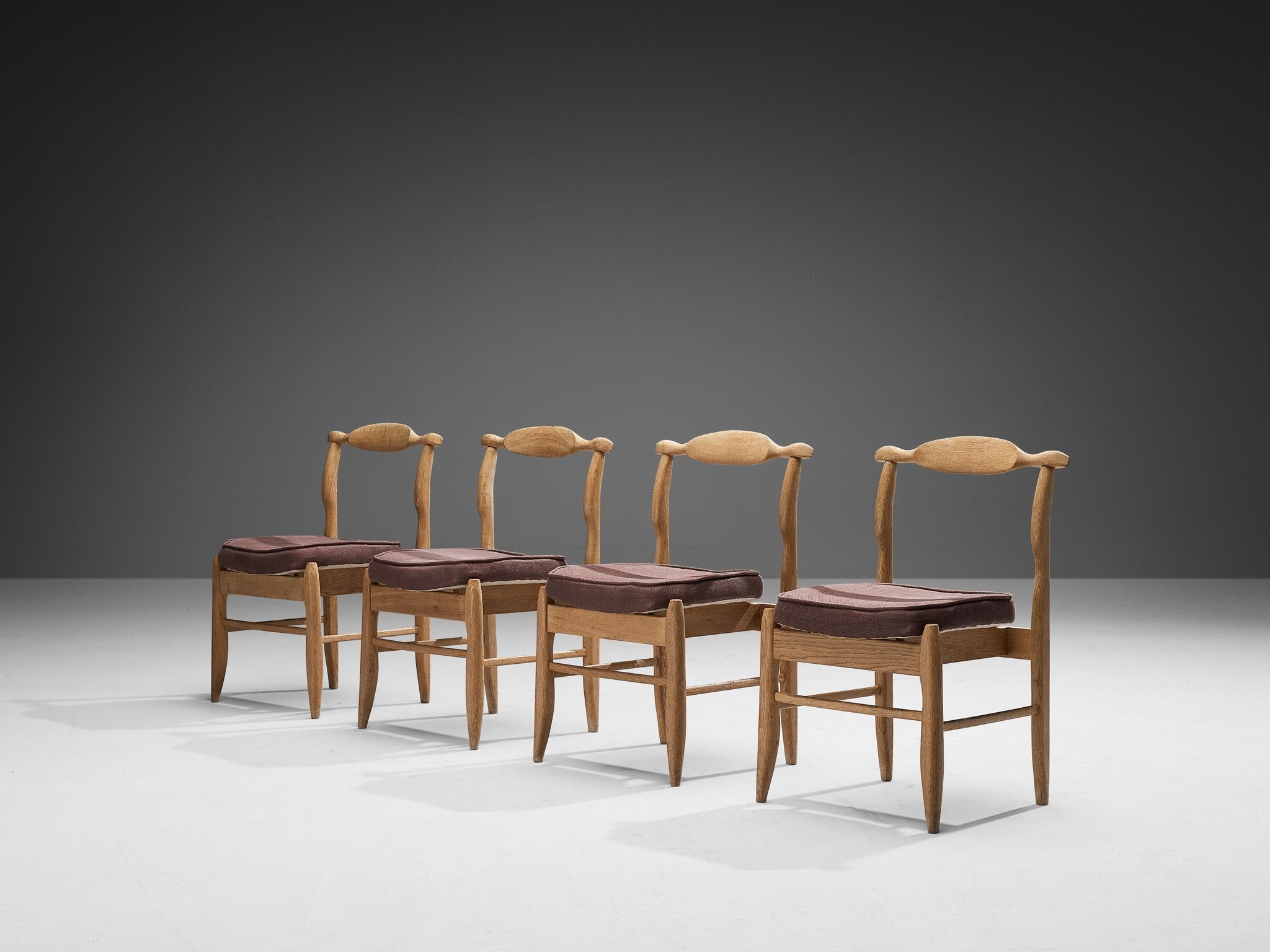 Guillerme et Chambron, set of four dining chairs model 'Fumay', oak, fabric, France, 1960s

Beautifully shaped chairs in patinated oak by French designer duo Jacques Chambron and Robert Guillerme. These dining chairs show beautiful lines in every