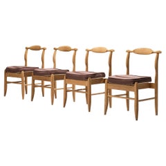 Guillerme & Chambron - Ensemble de quatre chaises de salle à manger en chêne