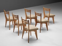 Guillerme & Chambron Juego de seis sillas de comedor en roble y tapicería beige