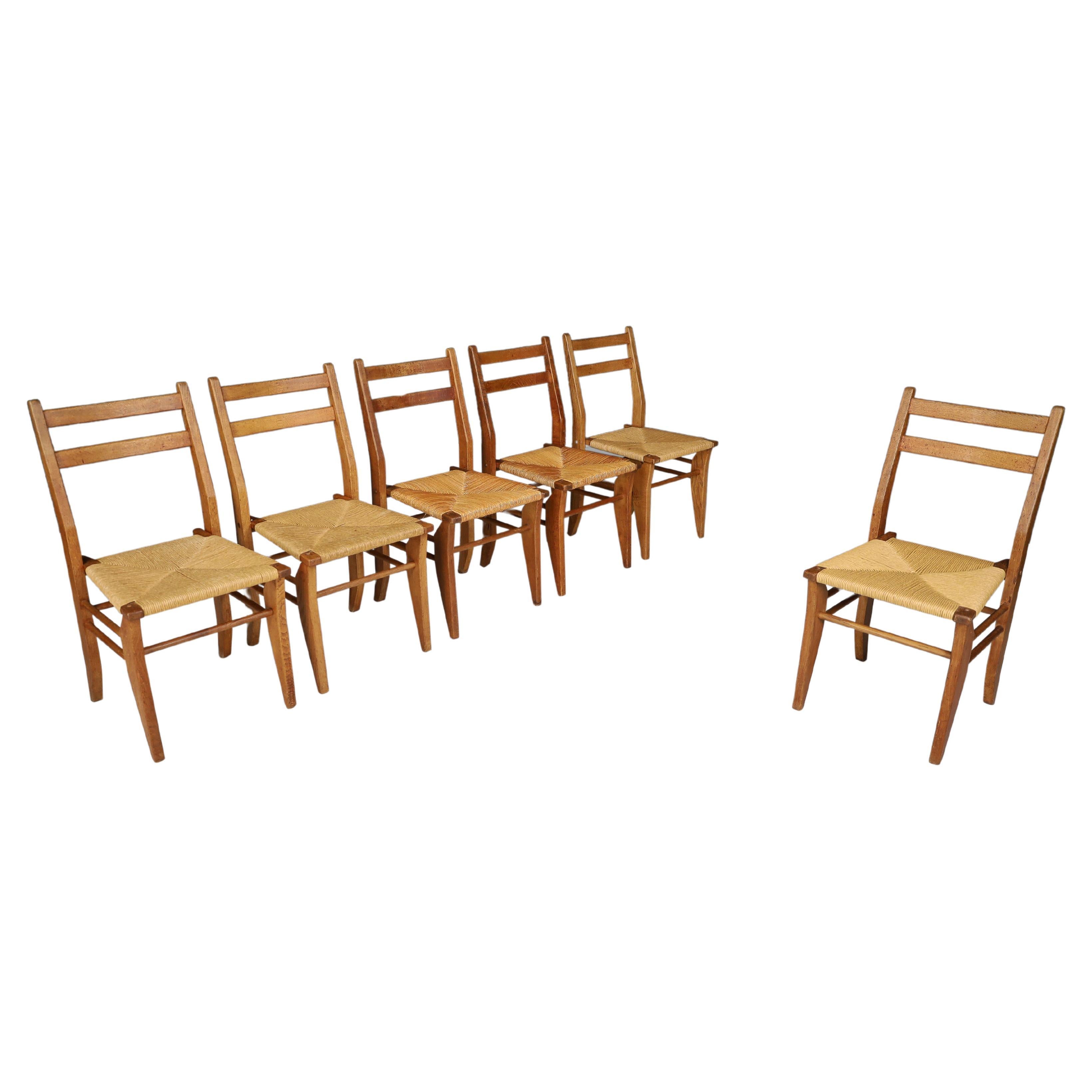Guillerme & Chambron, ensemble de six chaises de salle à manger en chêne et jonc, France, années 1960   