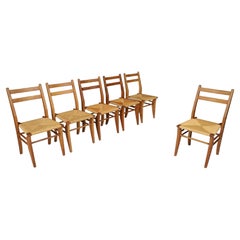 Guillerme & Chambron, ensemble de six chaises de salle à manger en chêne et jonc, France, années 1960   