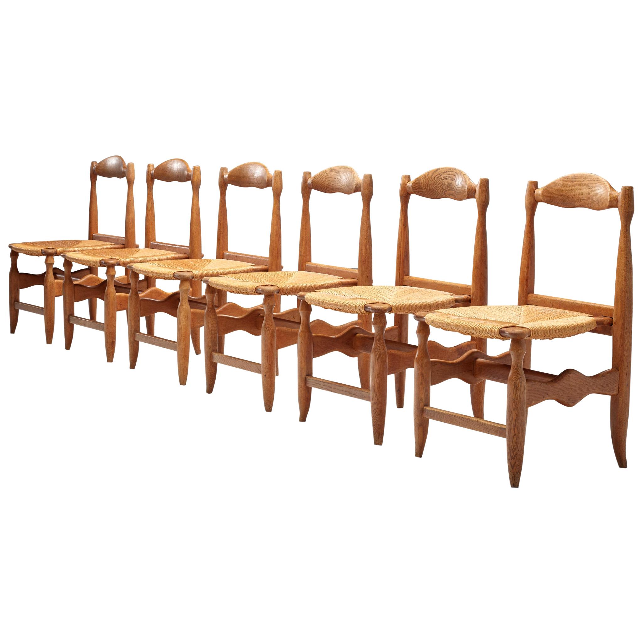 Guillerme & Chambron Set of Six Dining Chairs Model 'Charlotte' in Oak and Cane
