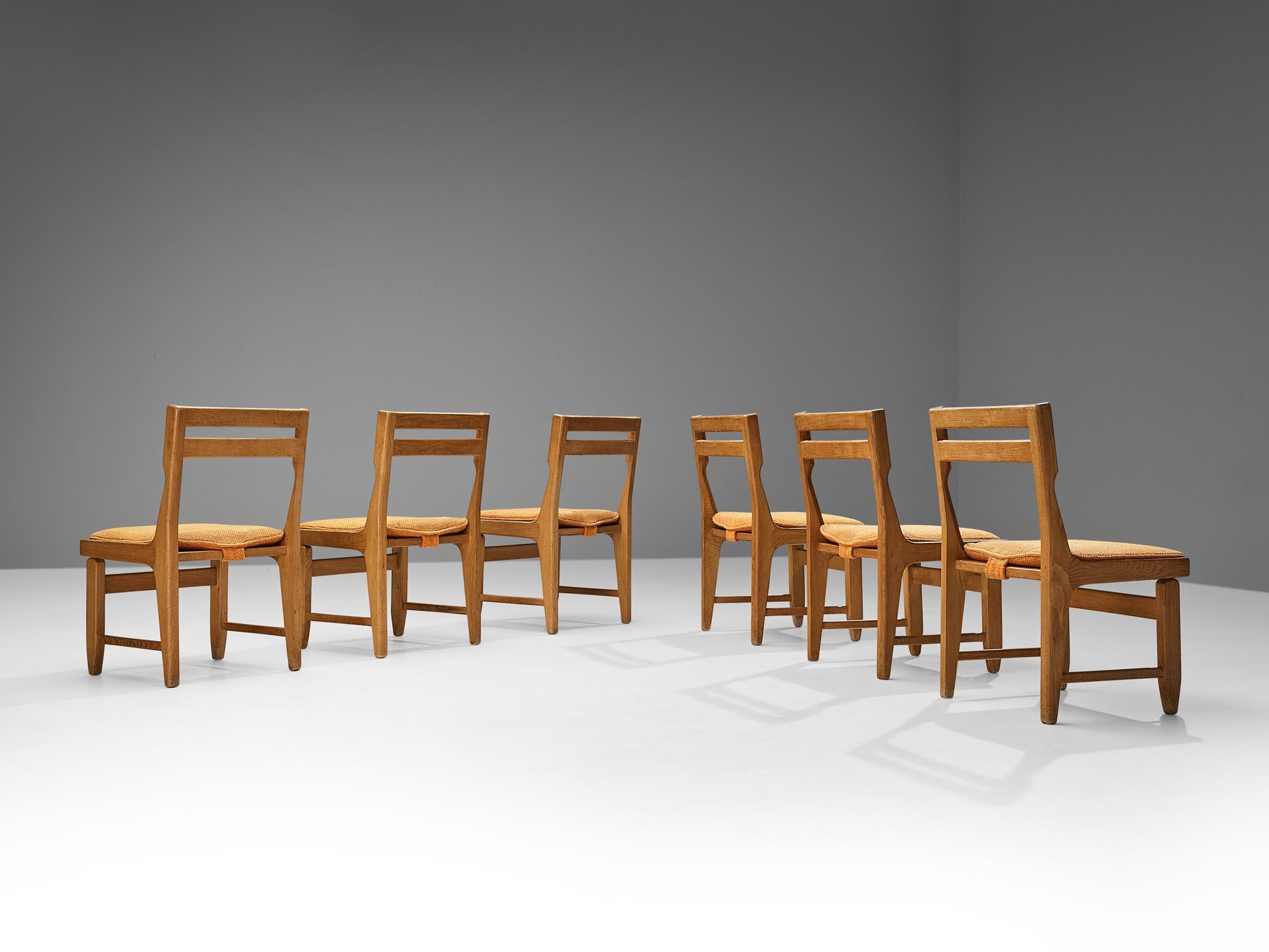 Guillerme & Chambron for Votre Maison, set of six dining chairs, model 'Raphaël', dark stained oak, fabric upholstery, France, 1960s 

This set of dining chairs shows the typical traits of the designs by French designer duo Guillerme et Chambron.