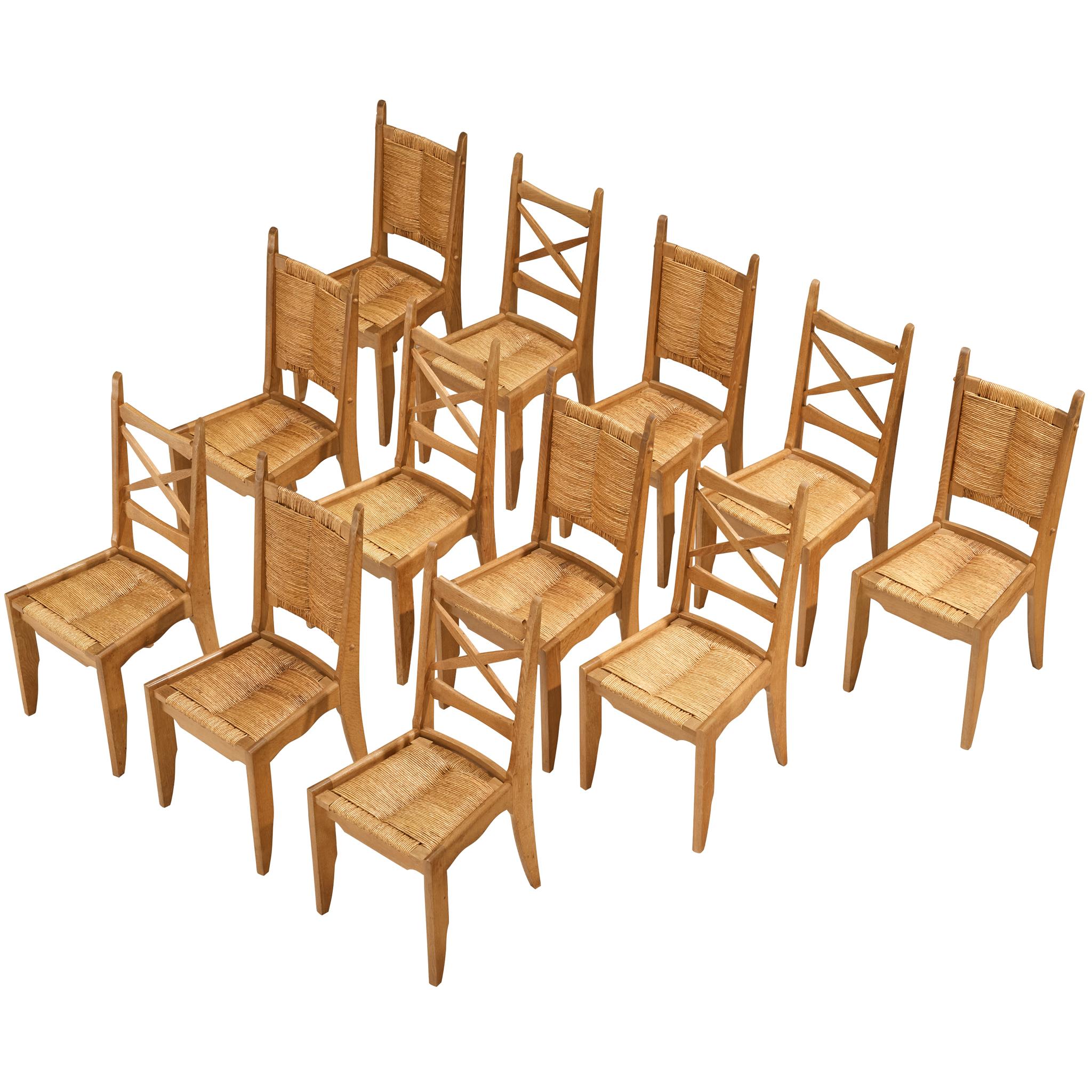 Guillerme & Chambron Set of Twelve Dining Chairs in Oak and Straw