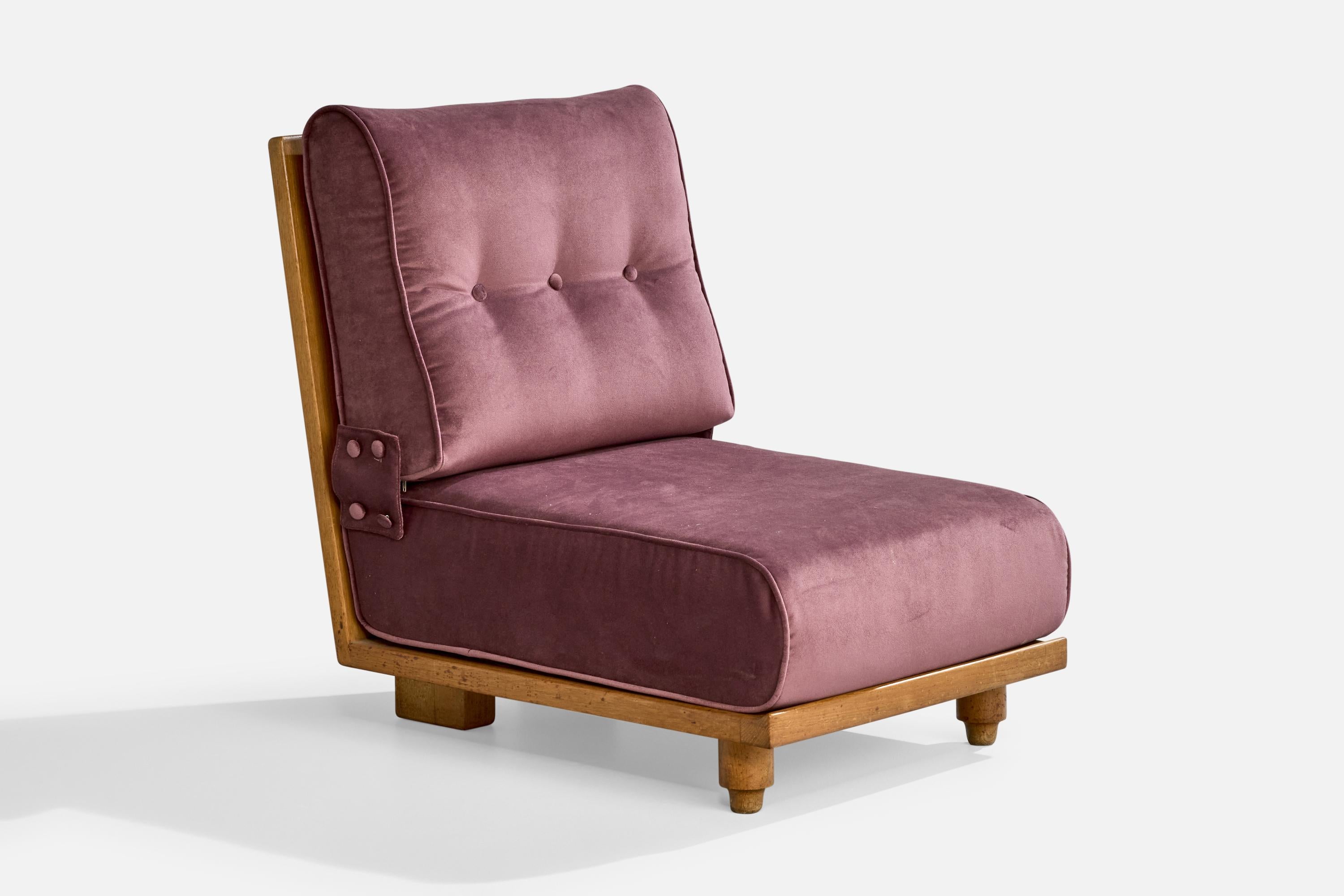 A purple velvet and oak slipper lounger chair designed and produced by Guillerme & Chambron, France, c. 1950s.

Reupholstered in brand new velvet.

Dimensions (Inches): 32.375” H x 23.5” W x 32.5” D

Seat Height (Inches): 13.5”