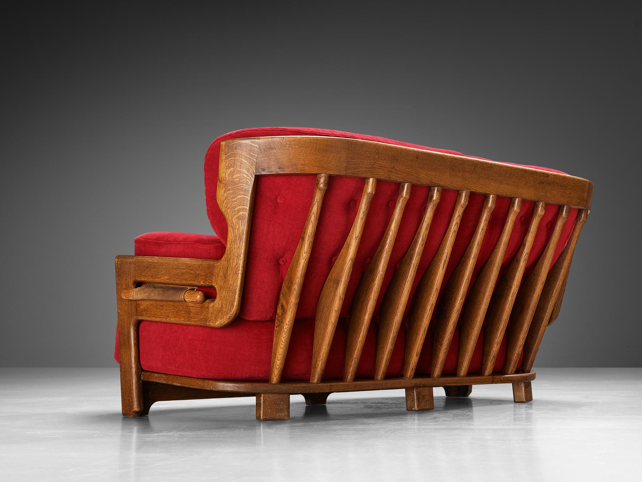 Guillerme et Chambron for Votre Maison, sofa model 'Denis', velvet, oak, France, 1960s

Extraordinary Guillerme and Chambron sofa in solid oak with the typical characteristic decorative details at the back and capricious forms of the legs. This