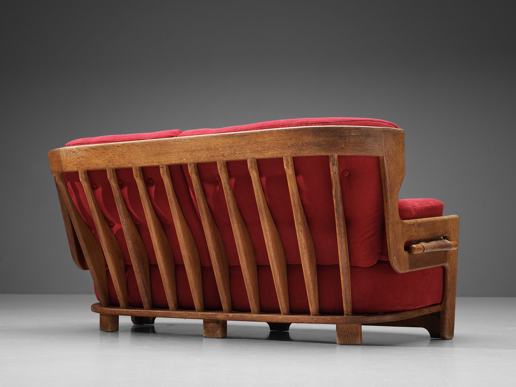 Guillerme & Chambron for Votre Maison, sofa model 'Denis', velvet, oak, leather France, 1960s

Extraordinary Guillerme and Chambron sofa in solid oak with the typical characteristic decorative details at the back and capricious forms of the legs.