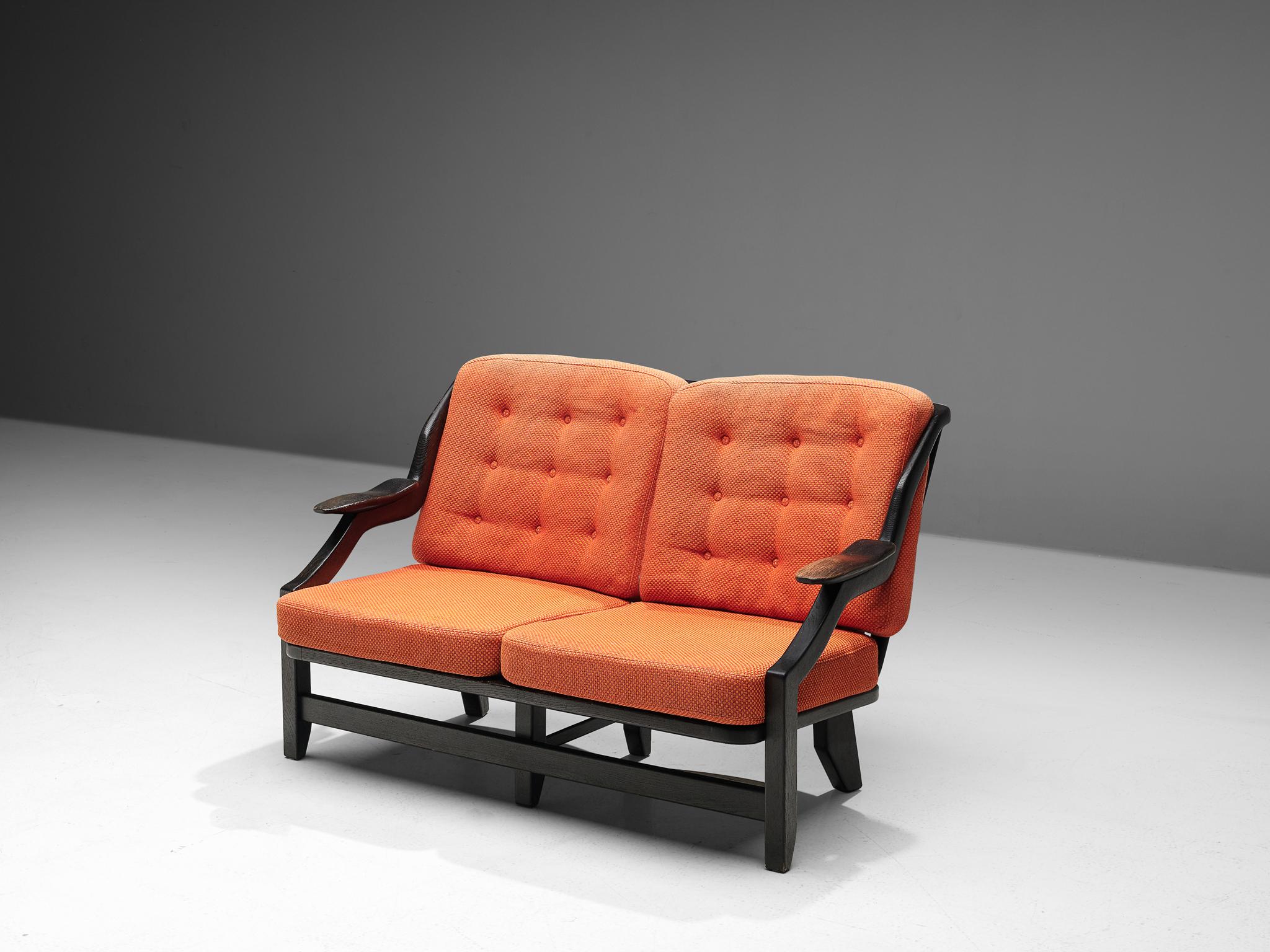 Guillerme & Chambron, settee, orange fabric and dark stained oak, France, 1950s.

A small sofa by Guillerme et Chambron, this French designer duo is known for their extreme high quality solid oak furniture, from which this orange bench is another