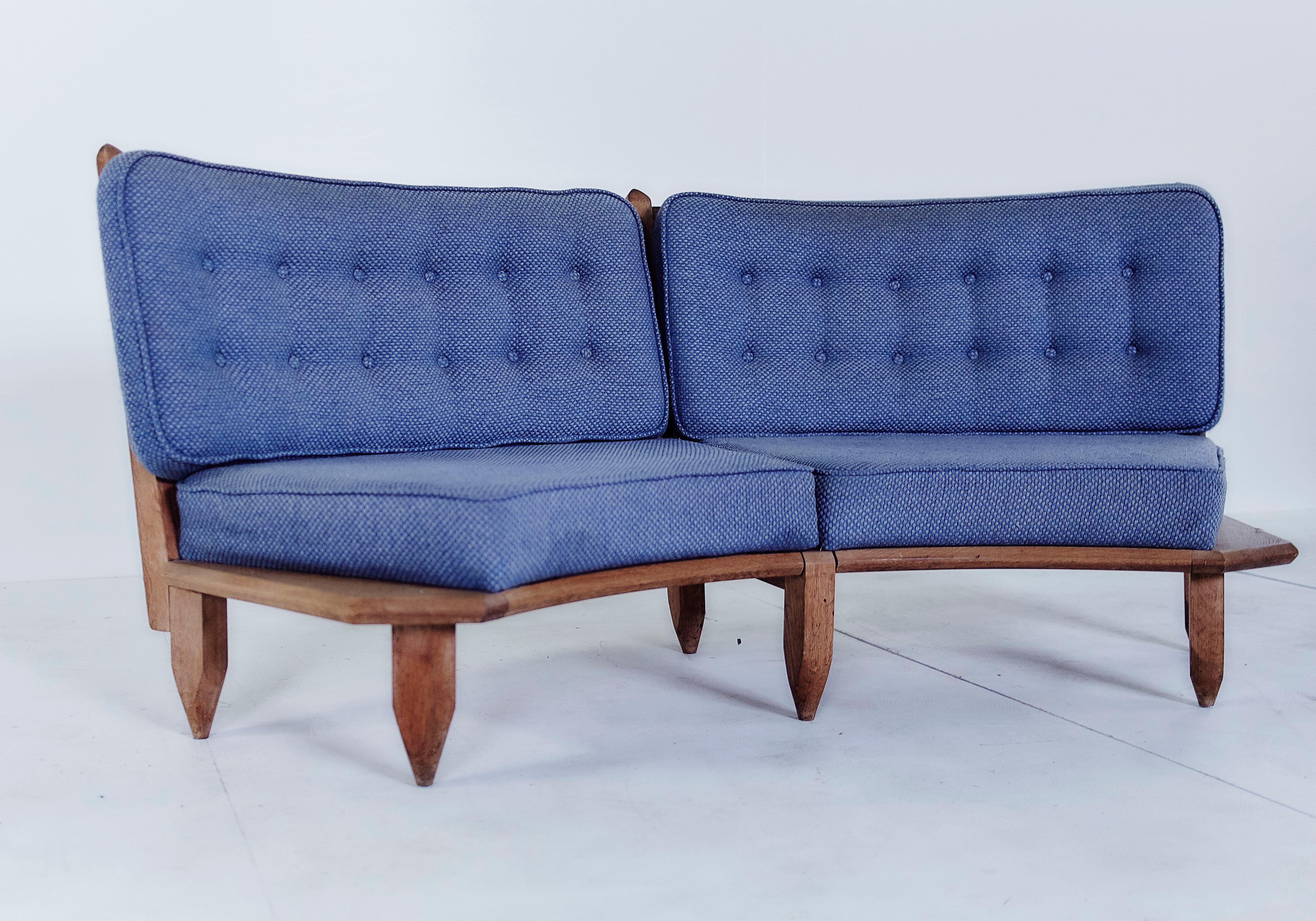 Curved sofa model, solid oak and original fabric, by Guillerme et Chambron, France, 1960.

The duo is known for their high-quality solid oak furniture.

Robert Guillerme (1913-1990) and Jacques Chambron (1914-2001).
Their company, Votre Maison,