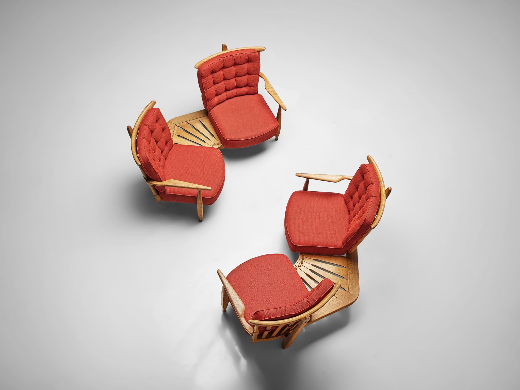 Guillerme et Chambron for Votre Maison, lounge chairs in oak, red upholstery, France, 1940s.

Guillerme and Chambron are known for their high quality solid oak furniture, from which this piece is another great example. The curved slatted back is an