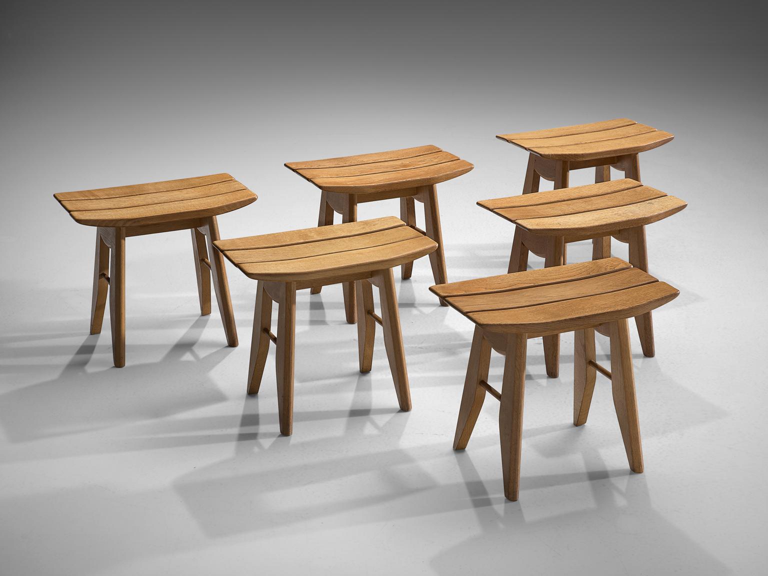 Guillerme et Chambron, set of six stools, solid oak, France, 1960s.

Set of six tabourets in oak by French designer duo Guillerme and Chambron. These stools have a sculptural, Japanese appearance. The top is made of three slats, the two on the