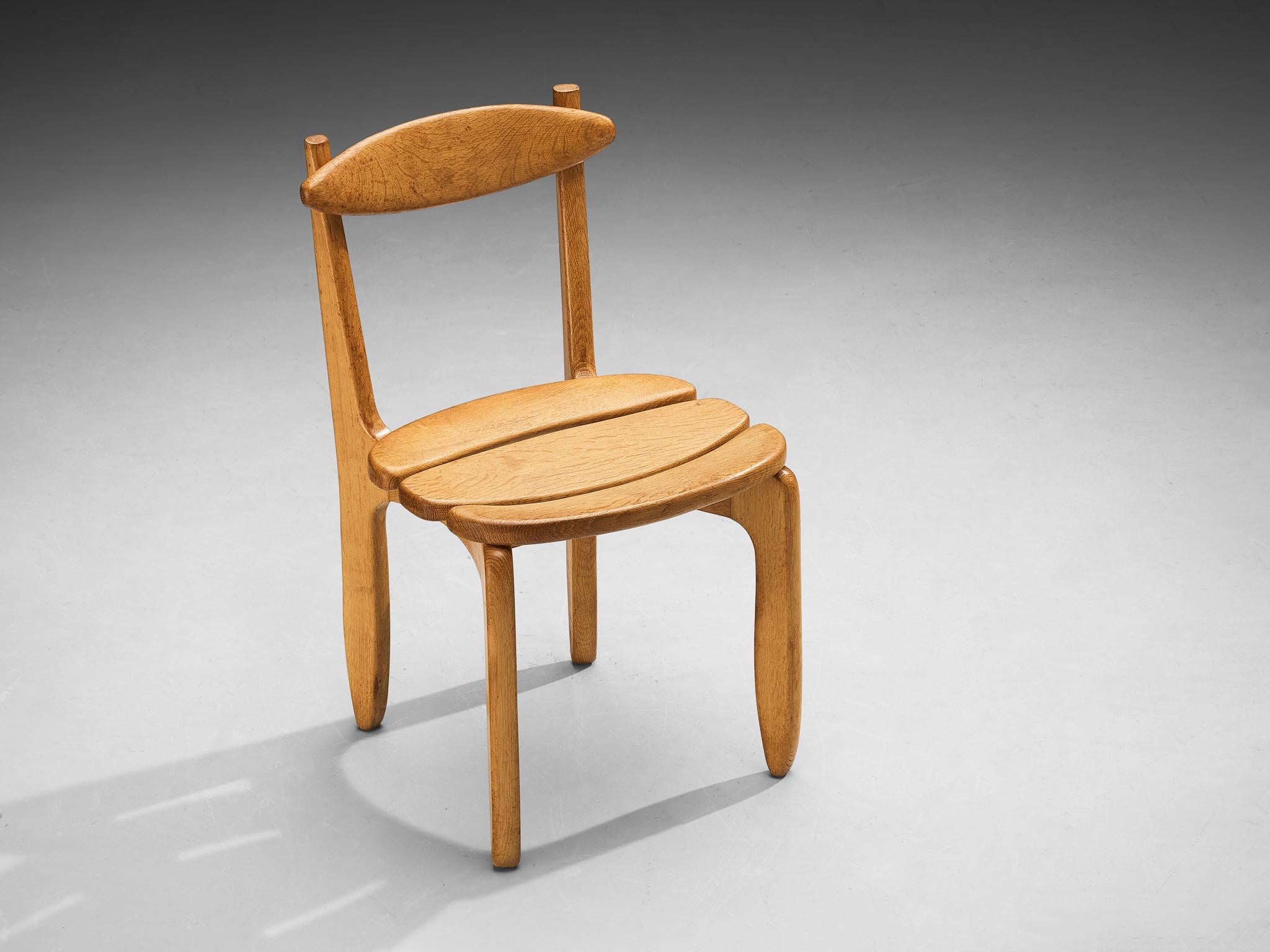 Guillerme et Chambron for Votre Maison, 'Thierry' dining chair, oak, France, 1960s.

An elegant and robust dining chair in solid oak by Guillerme and Chambron. This chair shows the characteristic frame of this French designer duo: well-crafted,
