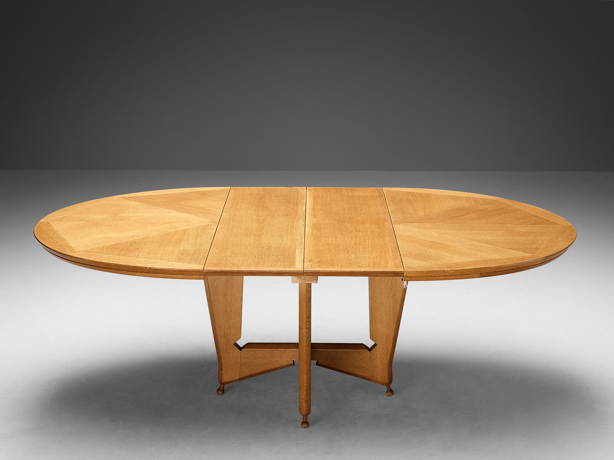 Guillerme et Chambron for Votre Maison, dining table model 'Victorine', oak, France, 1960s

This wonderful table shows great craftsmanship and a strong appearance, that clearly characterizes the work of Guillerme & Chambron. The top of the table has