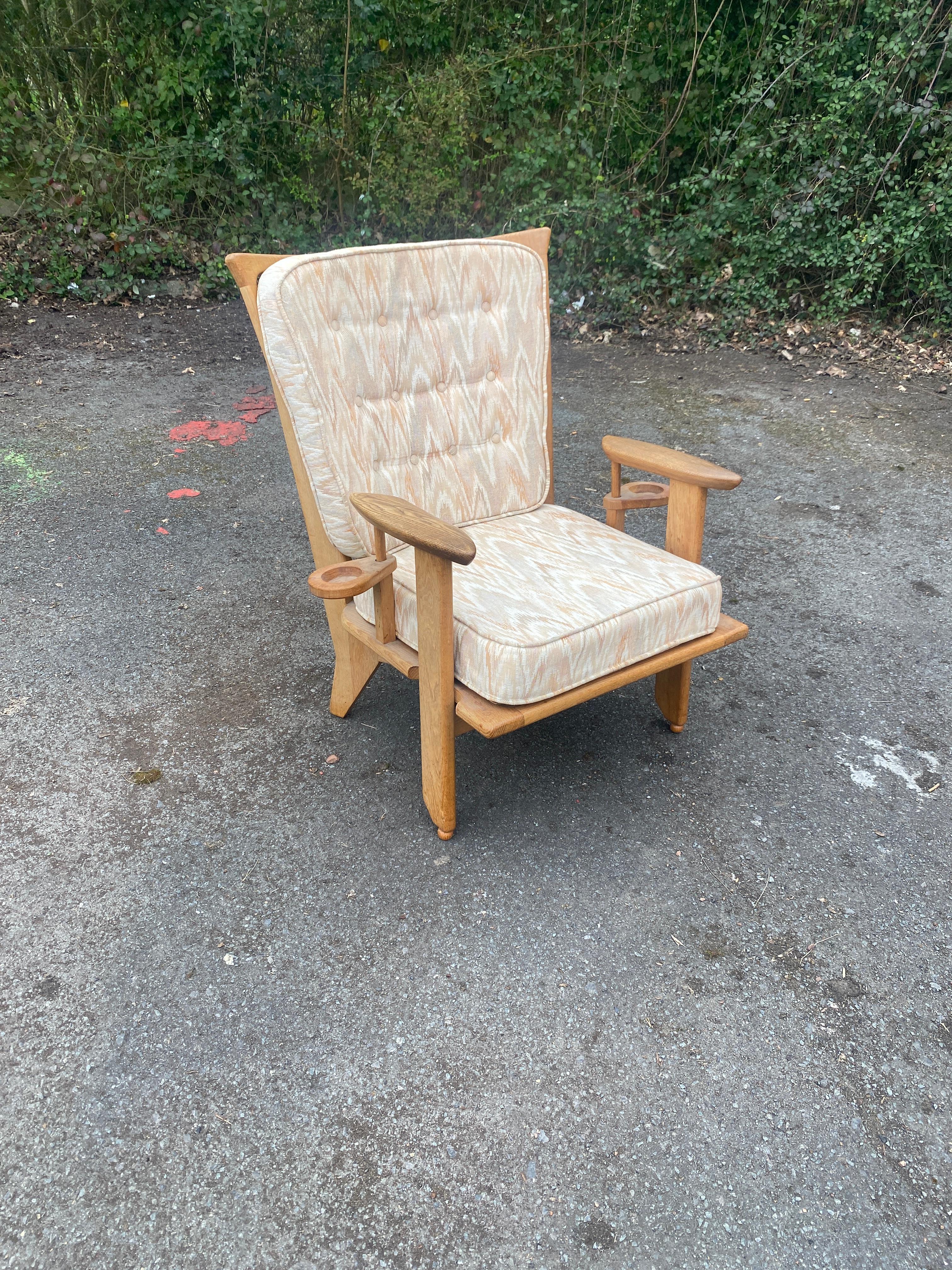 Guillerme et Chambron, 1970 oak armchair edited by Votre Maison.

Votre maison : a style, a concept, a mindset.
   The Votre Maison story begins in 1940 in Prussia, near the Mazaurien Lake. A stalag, a wooden camp... Gathered by the absurd