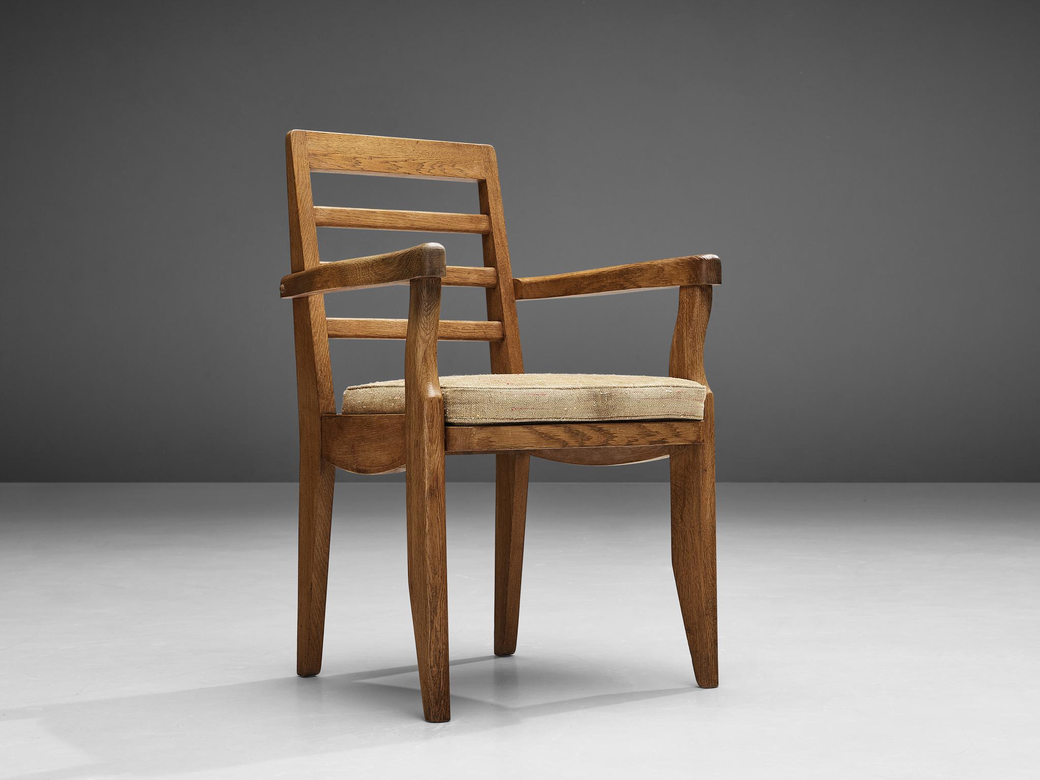 Guillerme et Chambron, armchair, oak, fabric upholstery, France, 1960s

This armchair features the characteristics of the French designer duo Guillerme et Chambron. The sculpted armrests are in contrast with the angular backrest that is structured