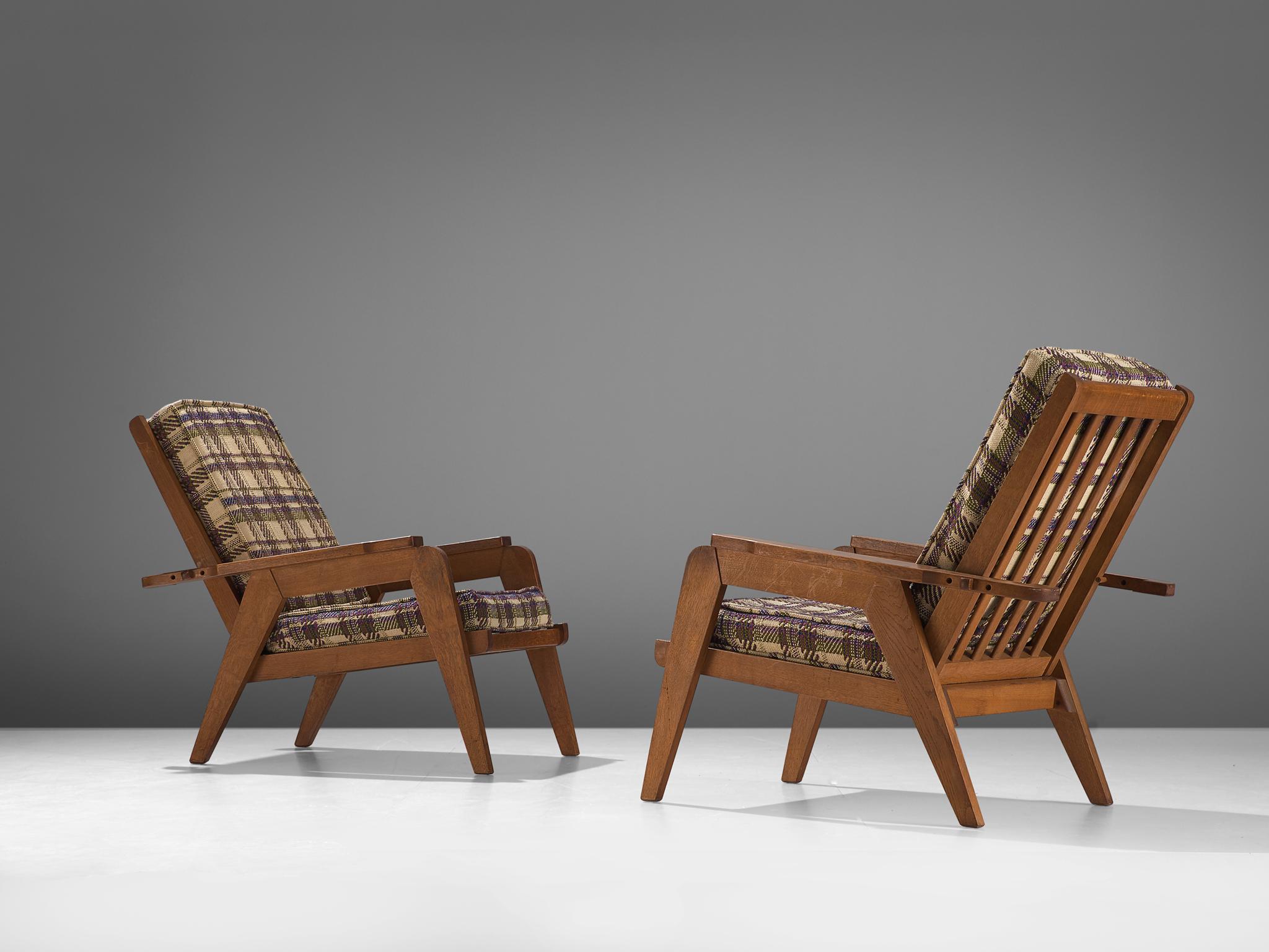 Guillerme et Chambron, pair of lounge chairs, oak and fabric, France, 1960s

This sculptural set of easy chairs by Guillerme and Chambron is very well executed and made out of solid, carved oak. The slatted backrests is adjustable thanks to the
