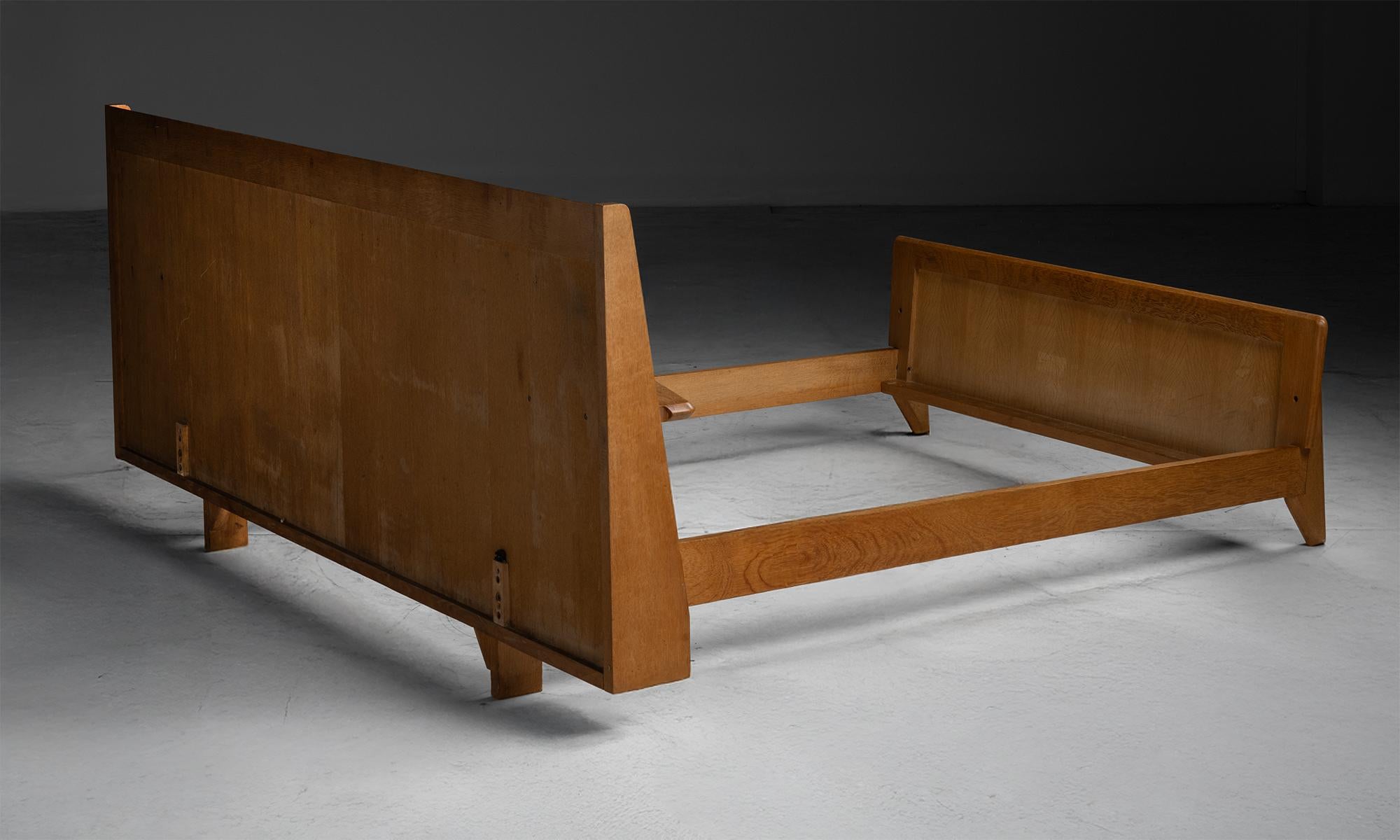 Guillerme et Chambron Bed Frame

France, 1960

Mid century modern bed frame composed of solid oak with sleek symmetrical design, fit for a 