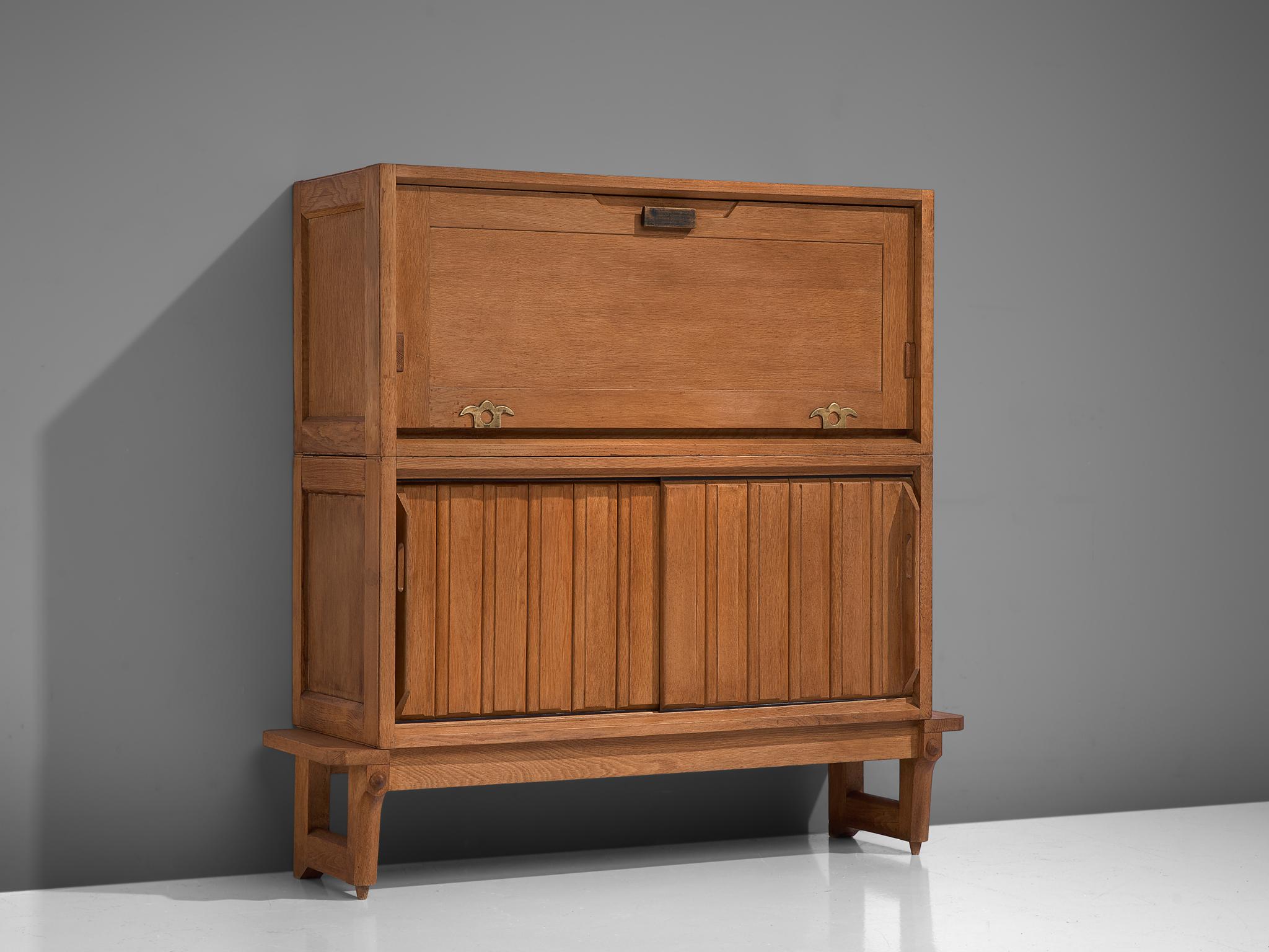 Guillerme and Chambron, high board, oak, France, 1950s

This sculptural cabinet is designed by the designer duo Guillerme and Chambron. The piece is executed in solid oak and consists of two large storage compartments, of which one opens from the