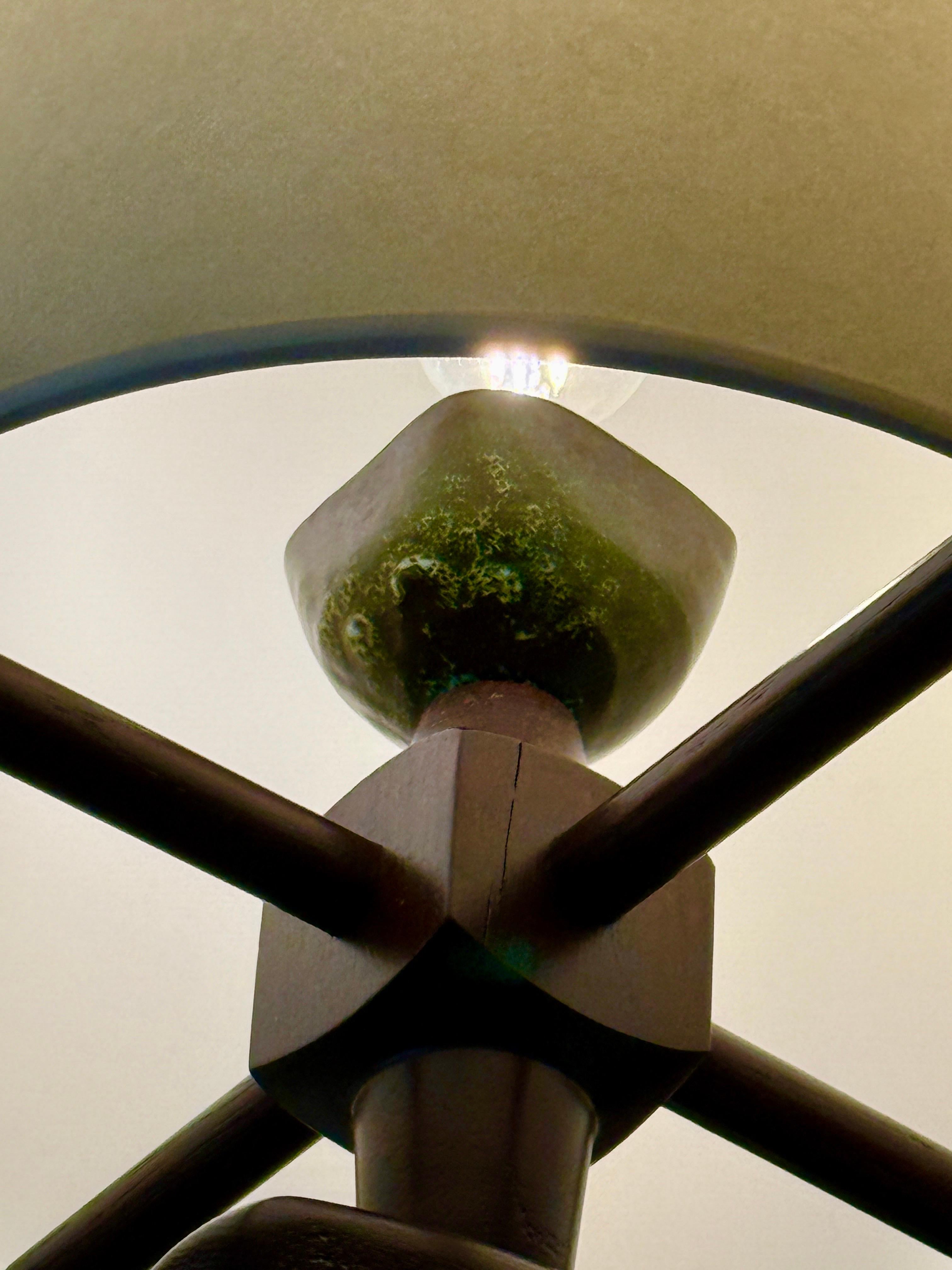 The classic beauty of French mid-century design by Guillerme et Chambron.  There is a dark green ceramic bulb holder and the dark wood turned wood details.  These are ceiling mounted lights with NEWLY made paper shades.