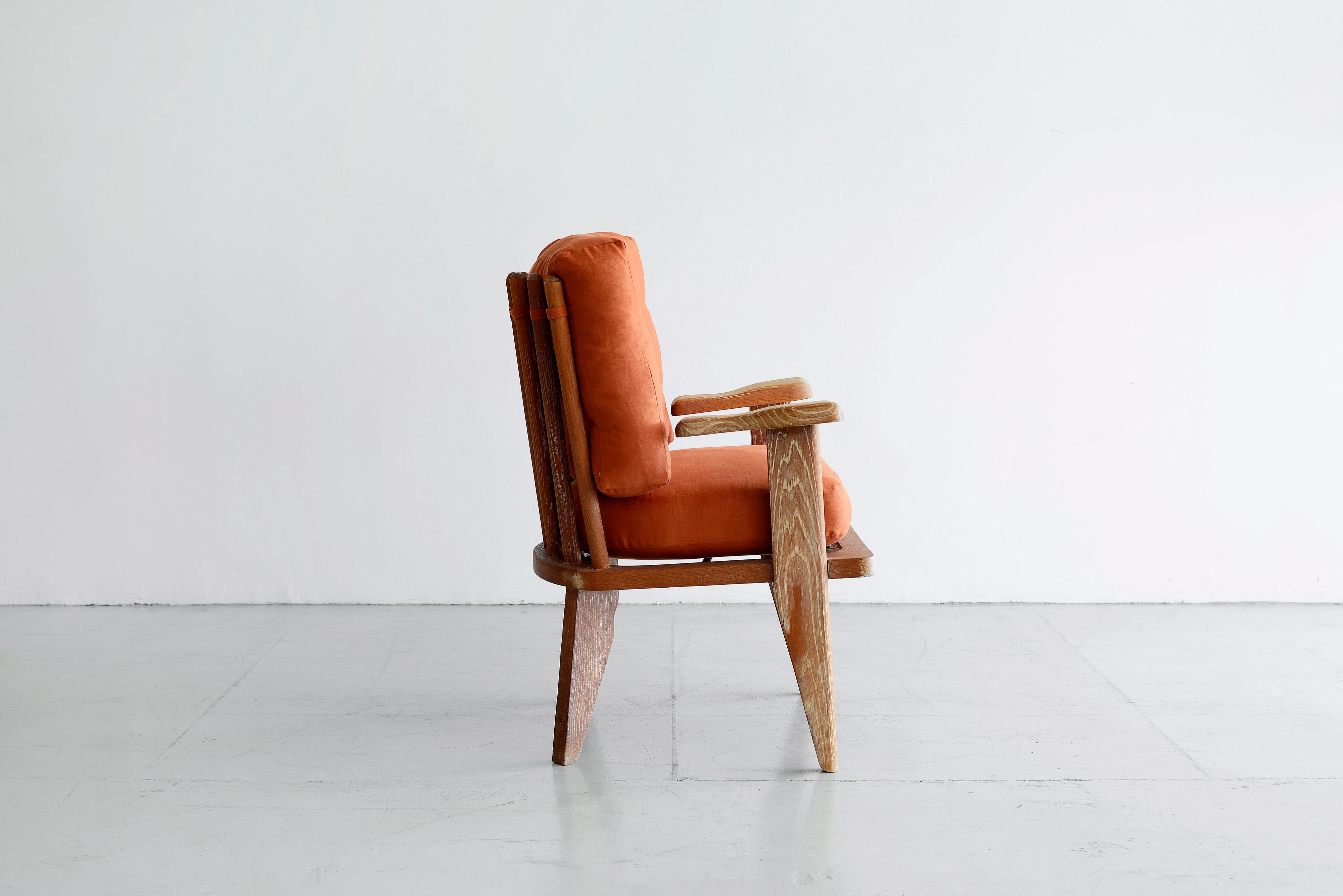 Guillerme et Chambron single armchair
Signature perused oak, floating armed frame and spindle back.
Reupholstered in burnt orange linen.