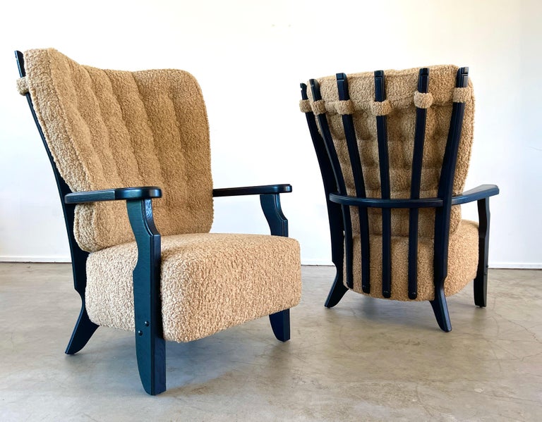 Guillerme et Chambron grande pair of chairs refinished in dark ebony and reupholstered in camel boucle.
