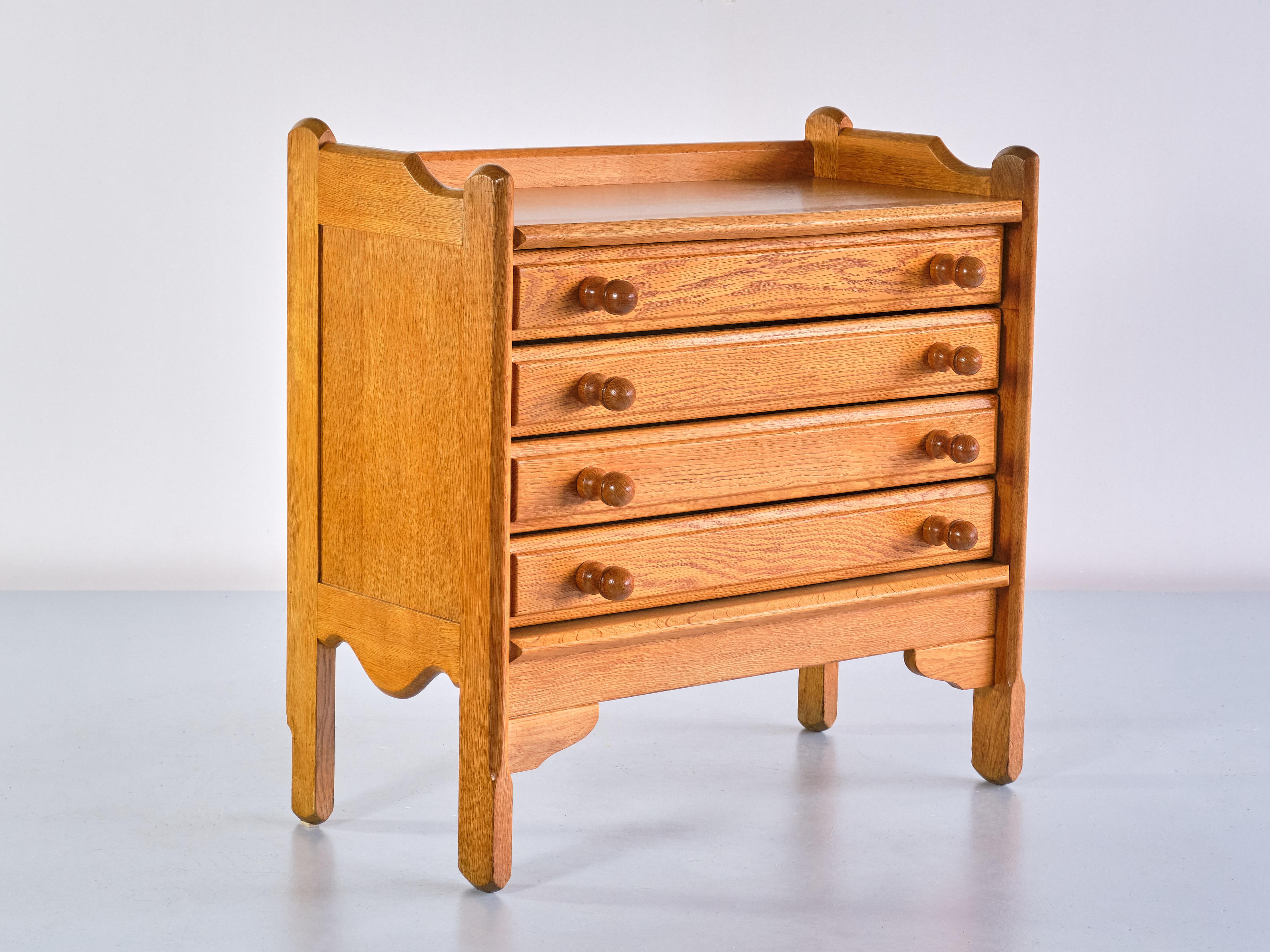 This striking chest of drawers was designed by Jacques Chambron and Robert Guillerme in the 1960s. It was produced by their company Votre Maison in Northern France.

The chest of drawers is made of a light solid oak wood with a very attractive