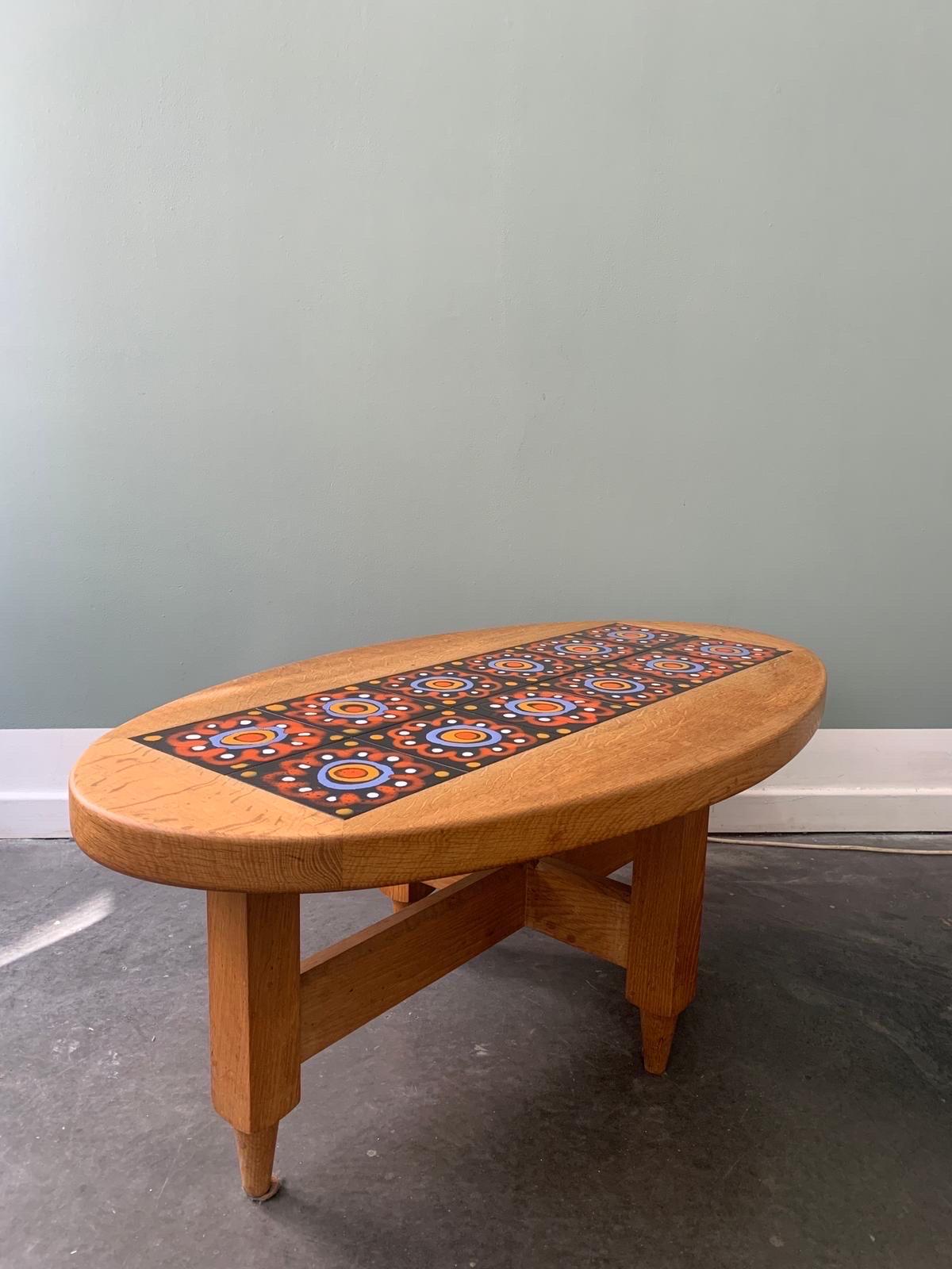 An oval oak and ceramic coffee table by Guillerme et Chambron, Edition Votre Maison
if the colors of the tiles not convenient we can offer others colors