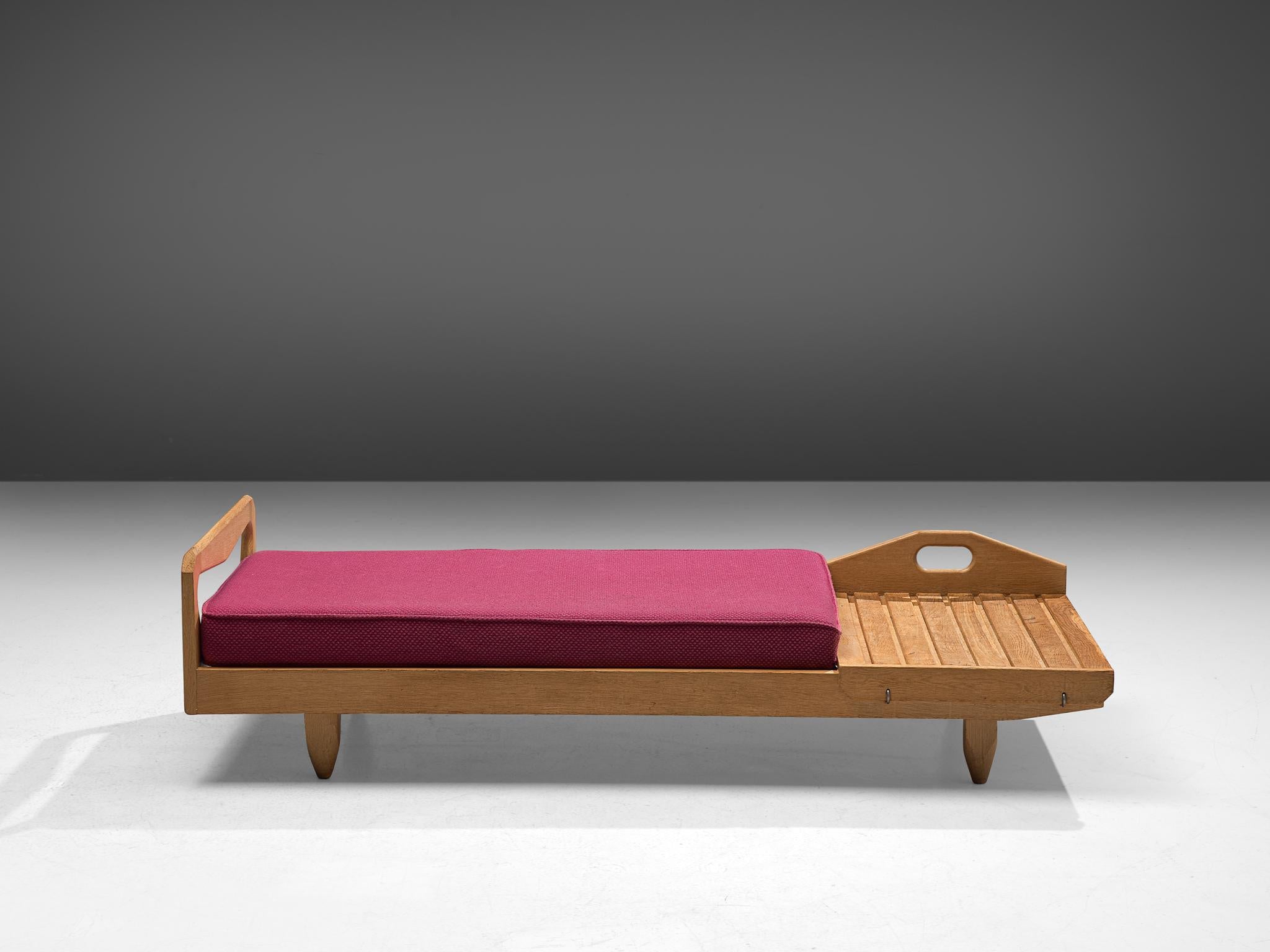 Guillerme et Chambron, daybed, oak and fabric, France, 1960s.

Sturdy sofa bed by Guillerme and Chambron, in solid oak with the typical characteristic decorative details and sculpted forms of the legs. The designs of the designer are known for