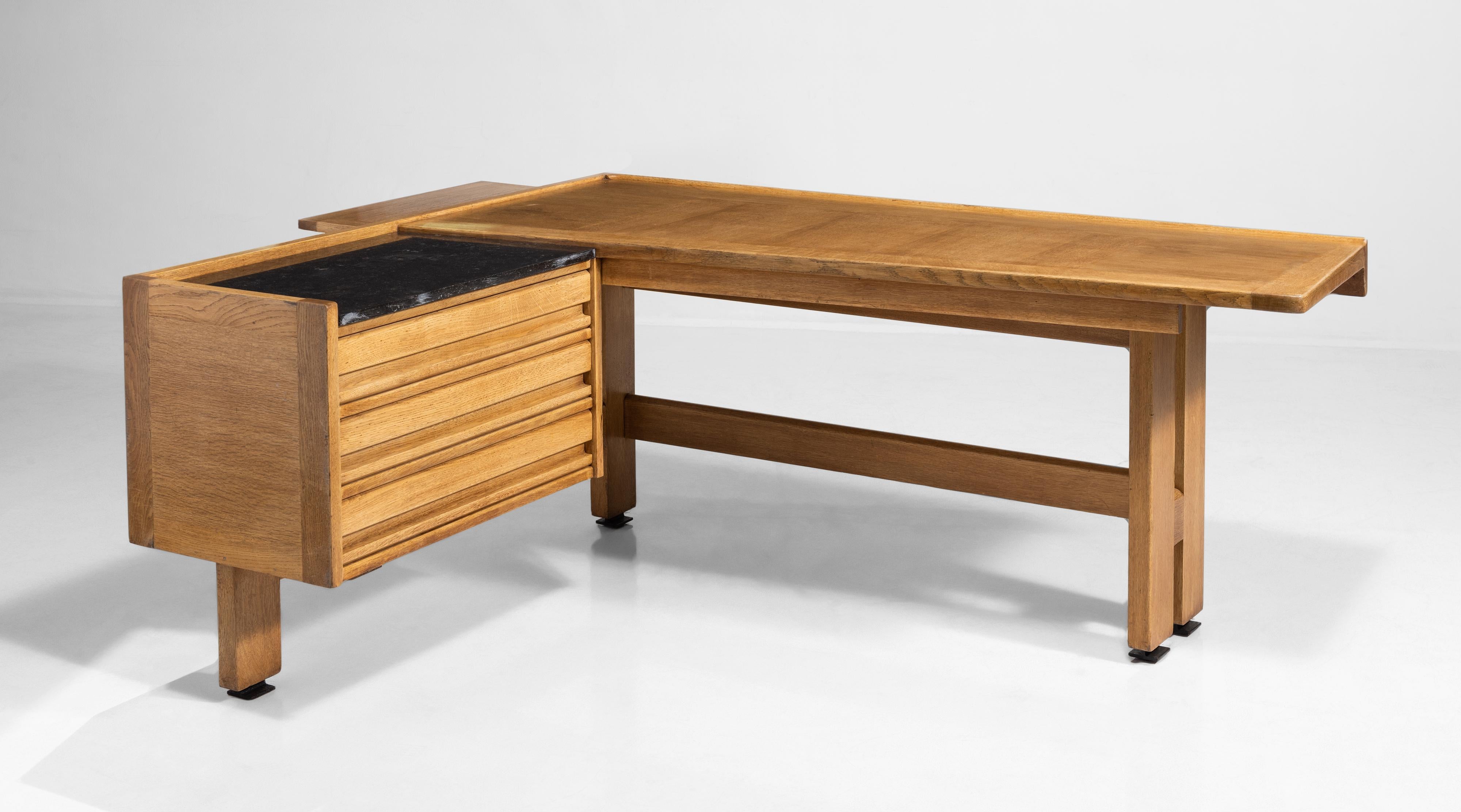 Beautiful oak “corner desk” with black granite top over three-drawer storage compartment.



Guillerme et Chambron desk
74.5” W x 59.5” D x 30” H.