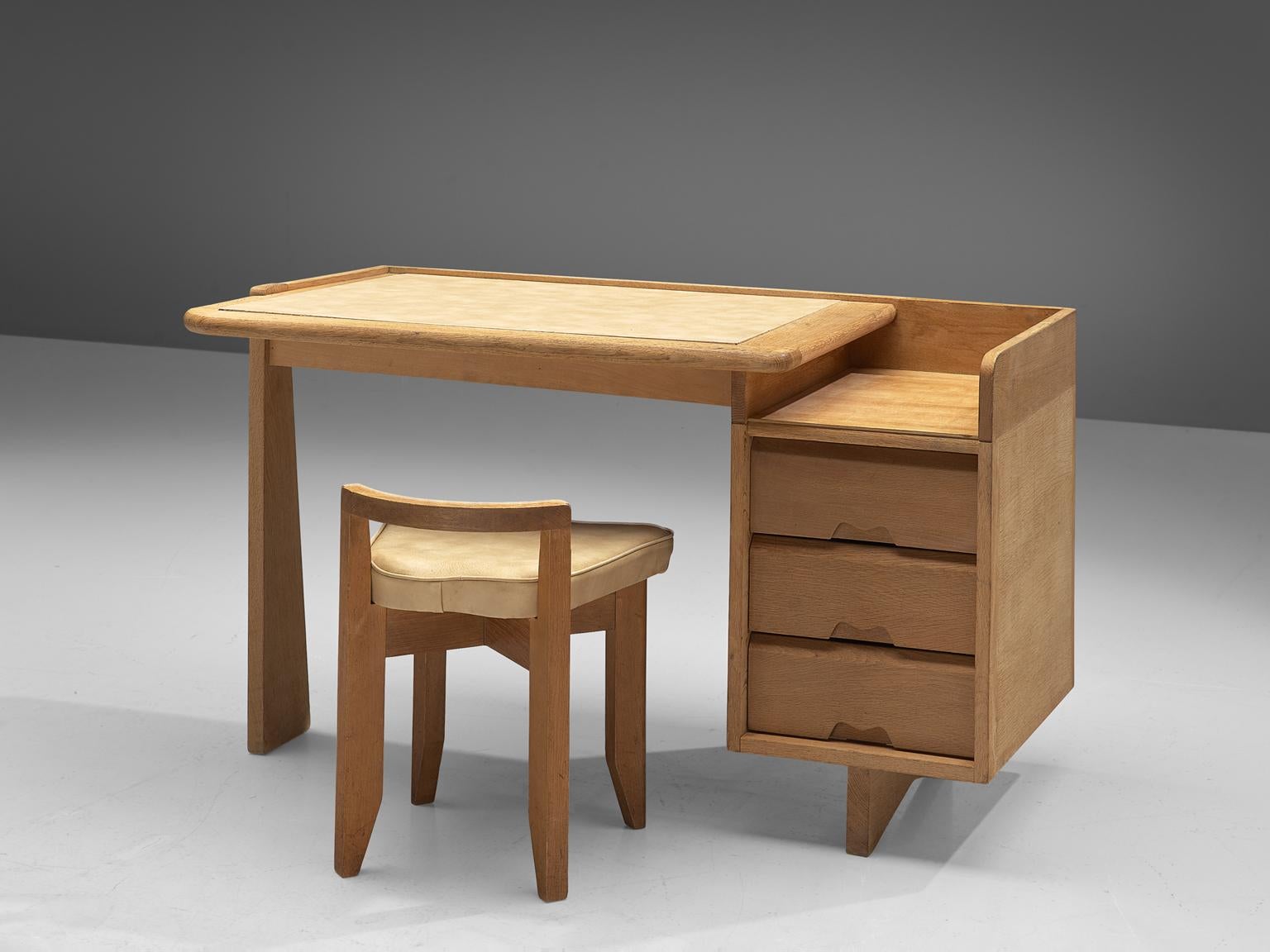 Guillerme et Chambron, desk, oak, fabric and leather, France, 1960s. 

These small desk and stool are designed by the French designer duo Guillerme and Chambron. The writing desk holds the characteristic decorations and lines of this duo such as the