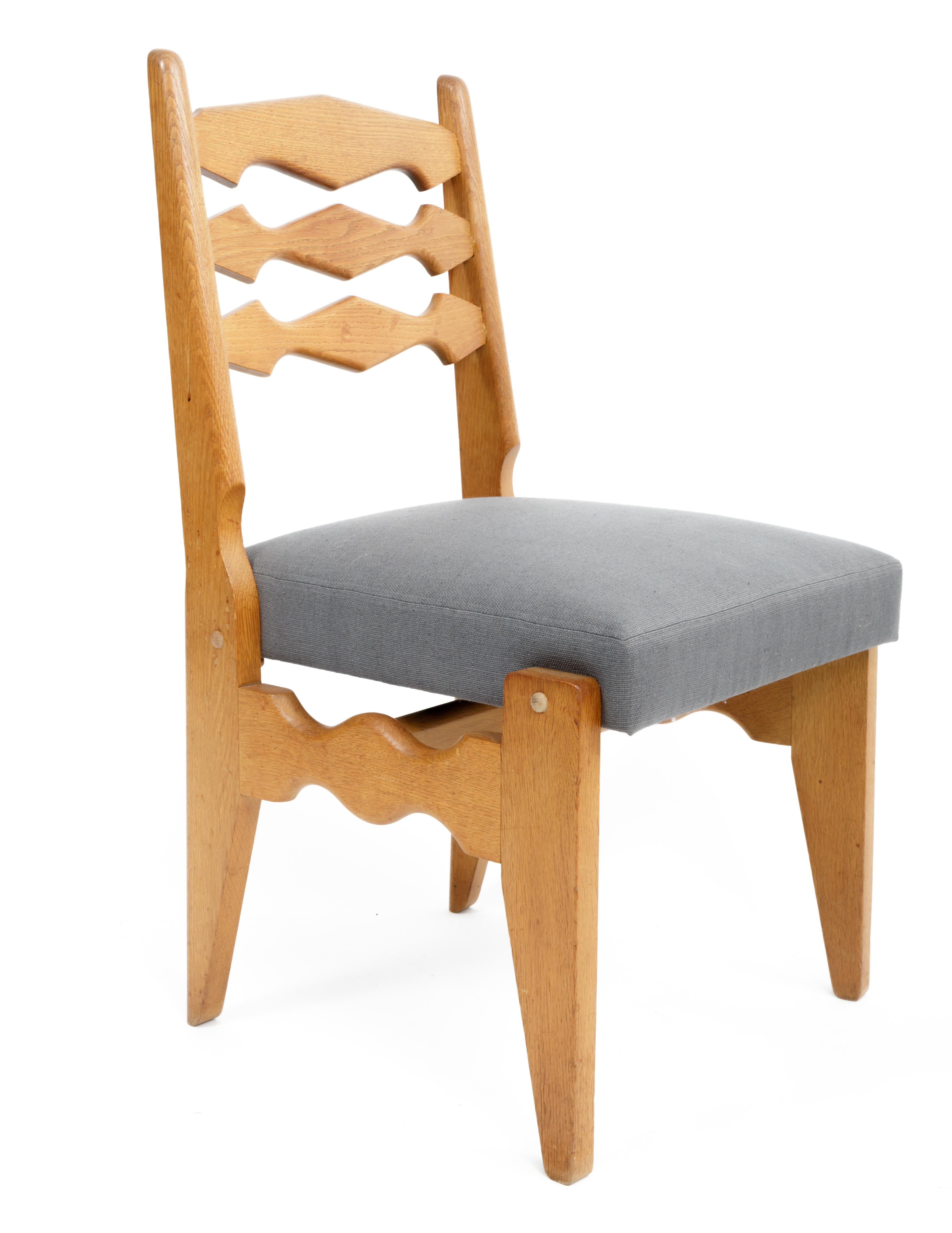 Set of 6 Oak Upholstered Dining Chairs by Guillerme et Chambron, France, circa 1970s.

Incredible design consists of solid oak construction. Sculptural frames and backrests with angular legs and new upholstery in a slate blue linen fabric. 