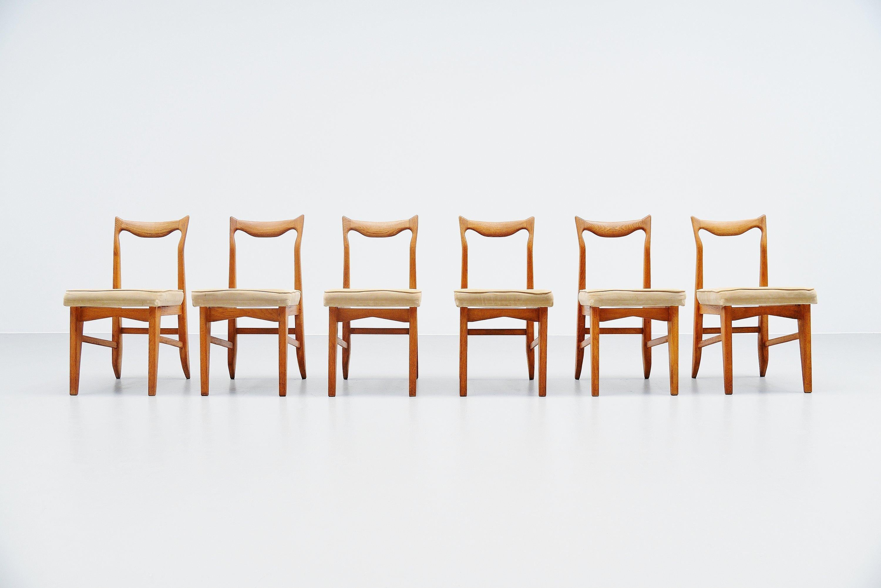 Set of 6 dining chairs designed by designer duo Robert Guillerme and Jacques Chambron, France 1950. The pieces were made in their own workshop and they made furniture from the 1950s to the 1970s. Mainly in solid oak and differently upholstery