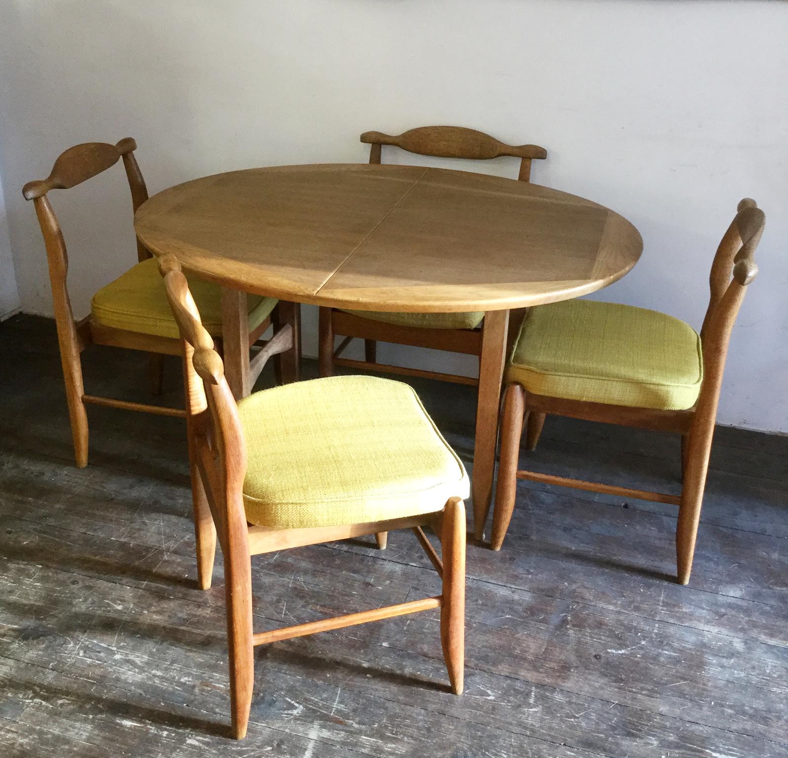 Guillerme et Chambron, extendable oak dining table set
Including four chairs model 