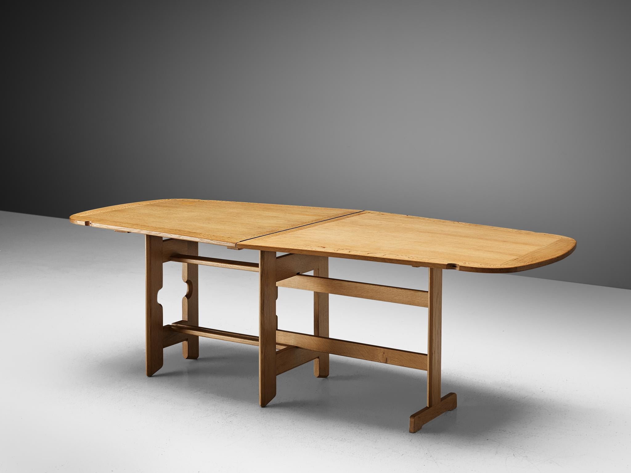 Guillerme et Chambron, drop-leaf dining table, oak, 1960s.

Large freeform shaped dining table with inlayed top. This table is perfect to place against a wall, or for additional seat placed free in the interior thanks to the drop-leaf. The