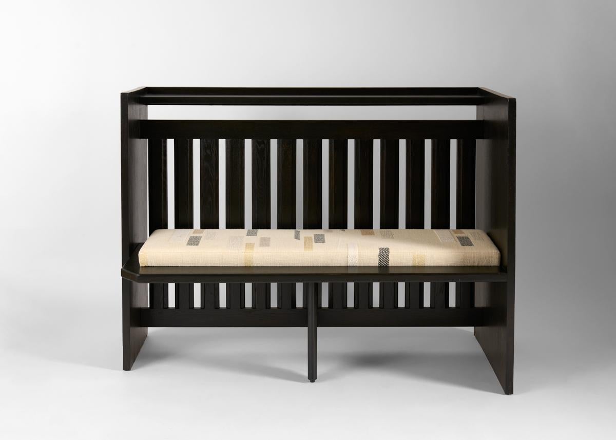 This midcentury, ebonized radiator cover by the celebrated French designer Robert Guillerme, was created as part of a line of design he produced for the company Votre Maison. Features an inset bench upholstered in Dedar fabric.

Robert Guillerme