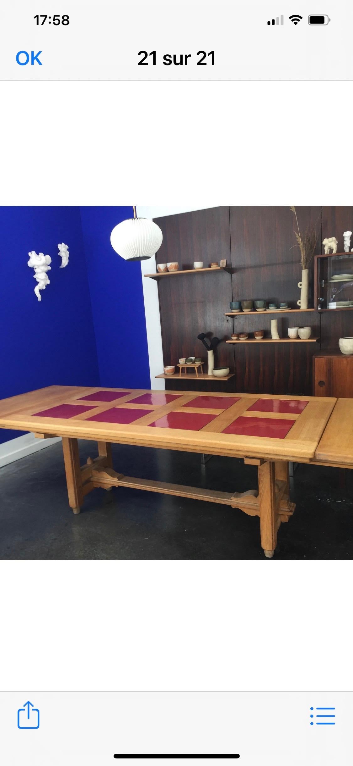 Extendable dining table by Guillerme et Chambron. On the main rectangular table top 8 square color can be change red or white
Table is 185cm long with two leaves of 50 cm each so open 285cm.