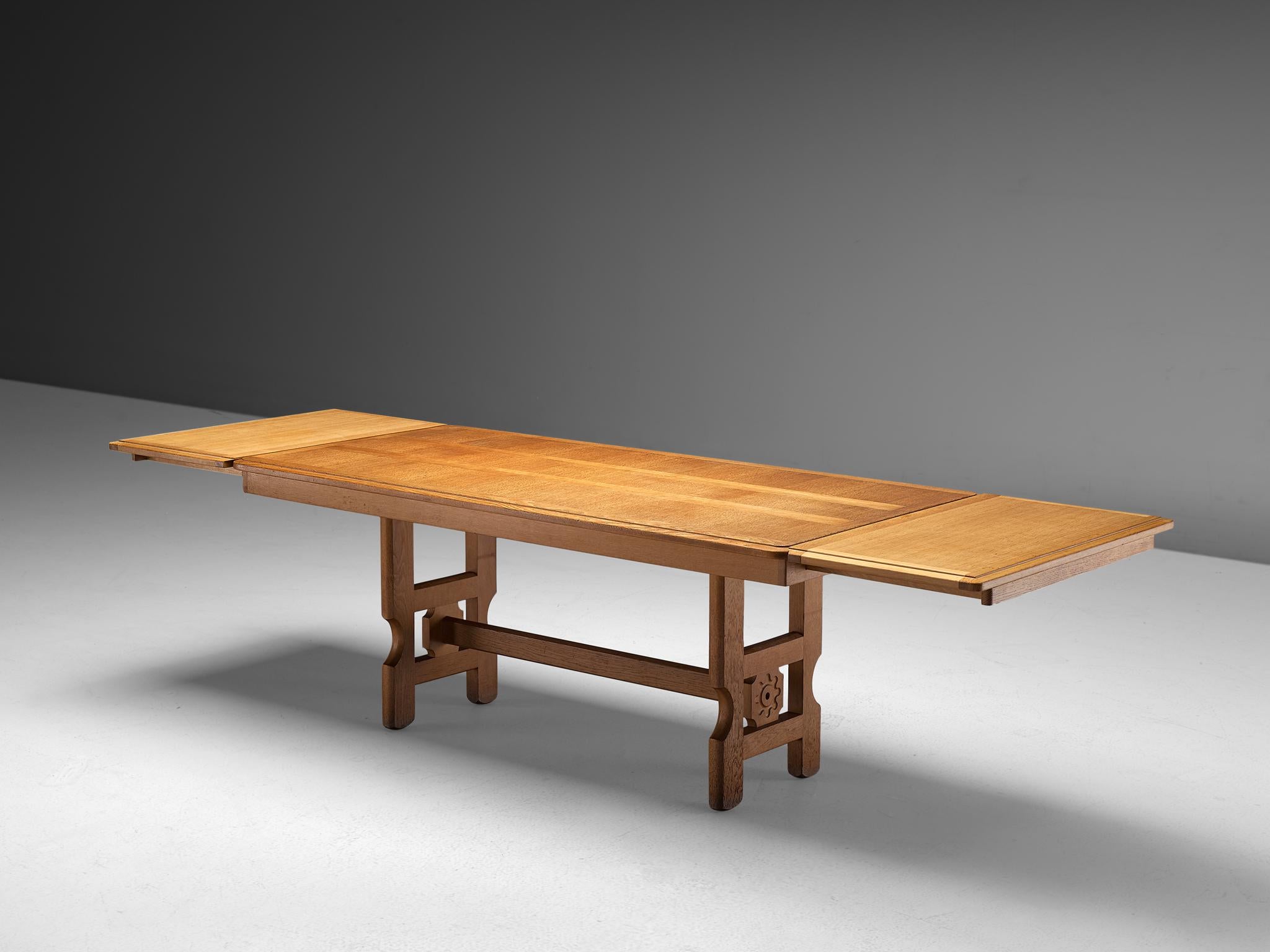 Guillerme et Chambron, dining table, oak, France, 1960s.

Extendable dining table in solid oak by French designers Guillerme et Chambron. This elegant table shows interesting details. Most attractive is the stunning sculpted legs that show beautiful