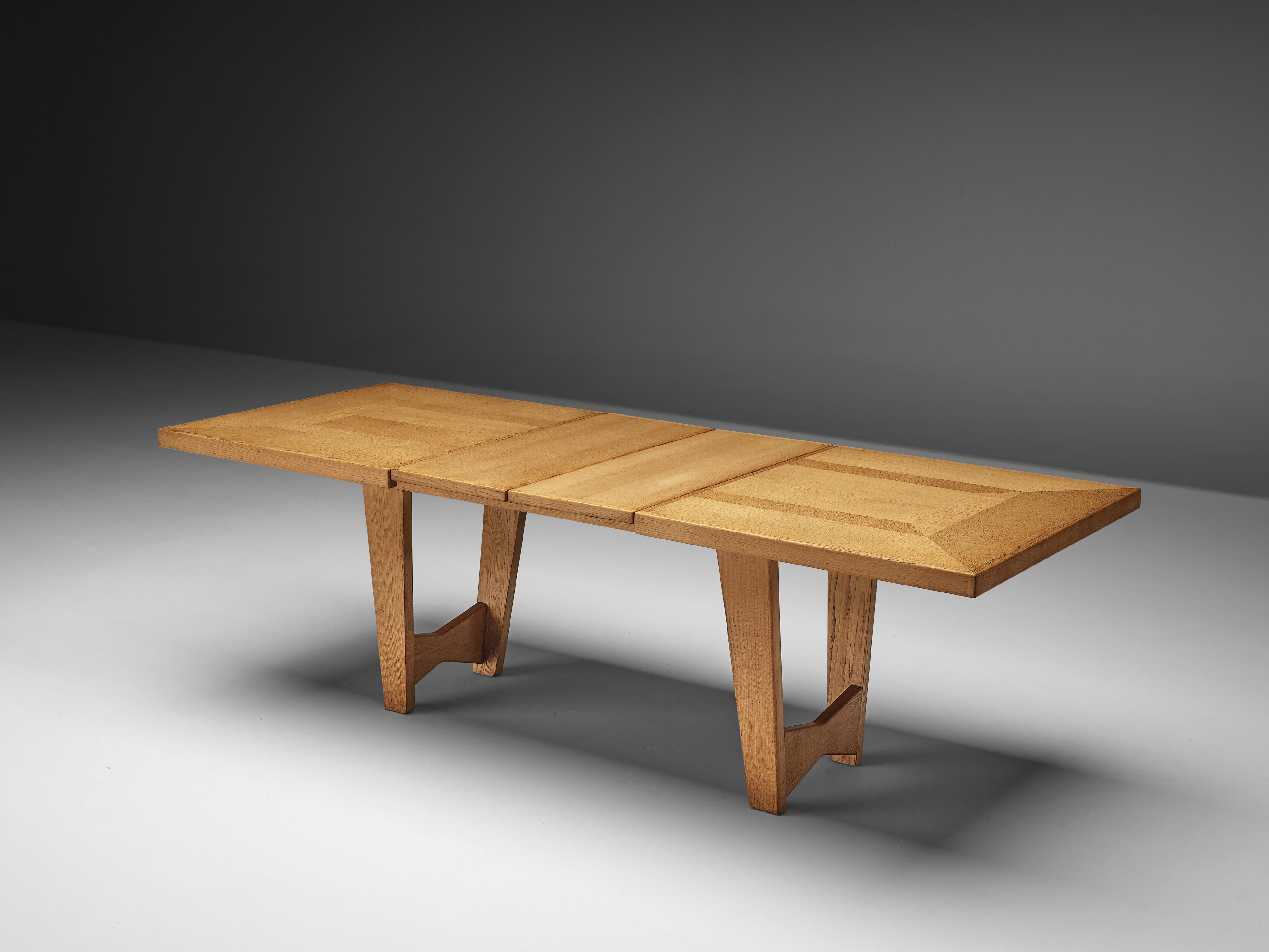 Guillerme et Chambron, dining table, oak, France, 1960s

Once again Guillerme et Chambron show their ability to combine great design with functionality. The rectangular tabletop can be extended with two extra leaves so the table is adjustable in