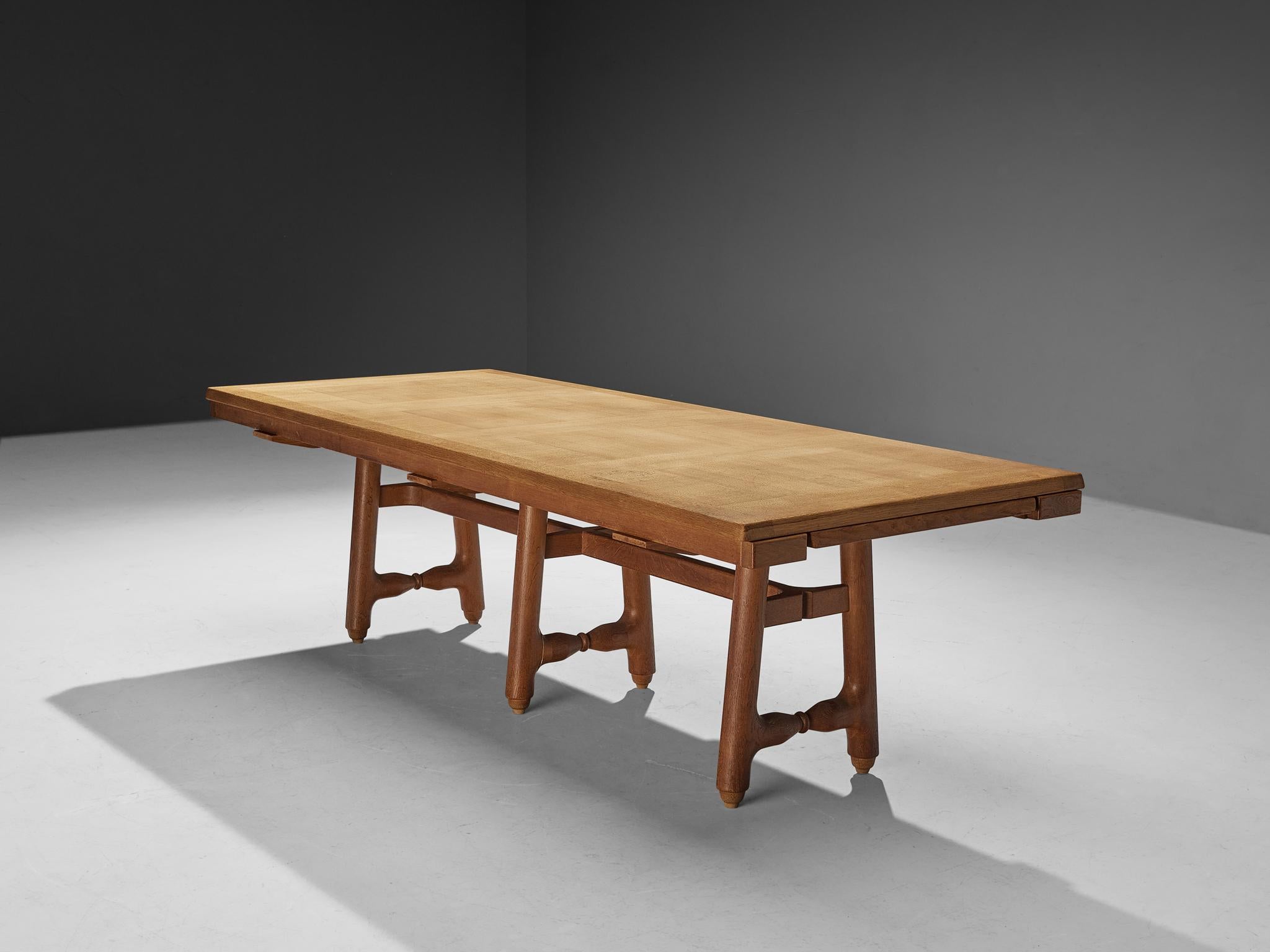 Guillerme et Chambron for Votre Maison, extendable dining table, model 'Gustave', oak, France, 1970s.

Exceptionally large dining table designed by Guillerme et Chambron in the 1970s. This 'Gustave' dining table shows the great craftsmanship that