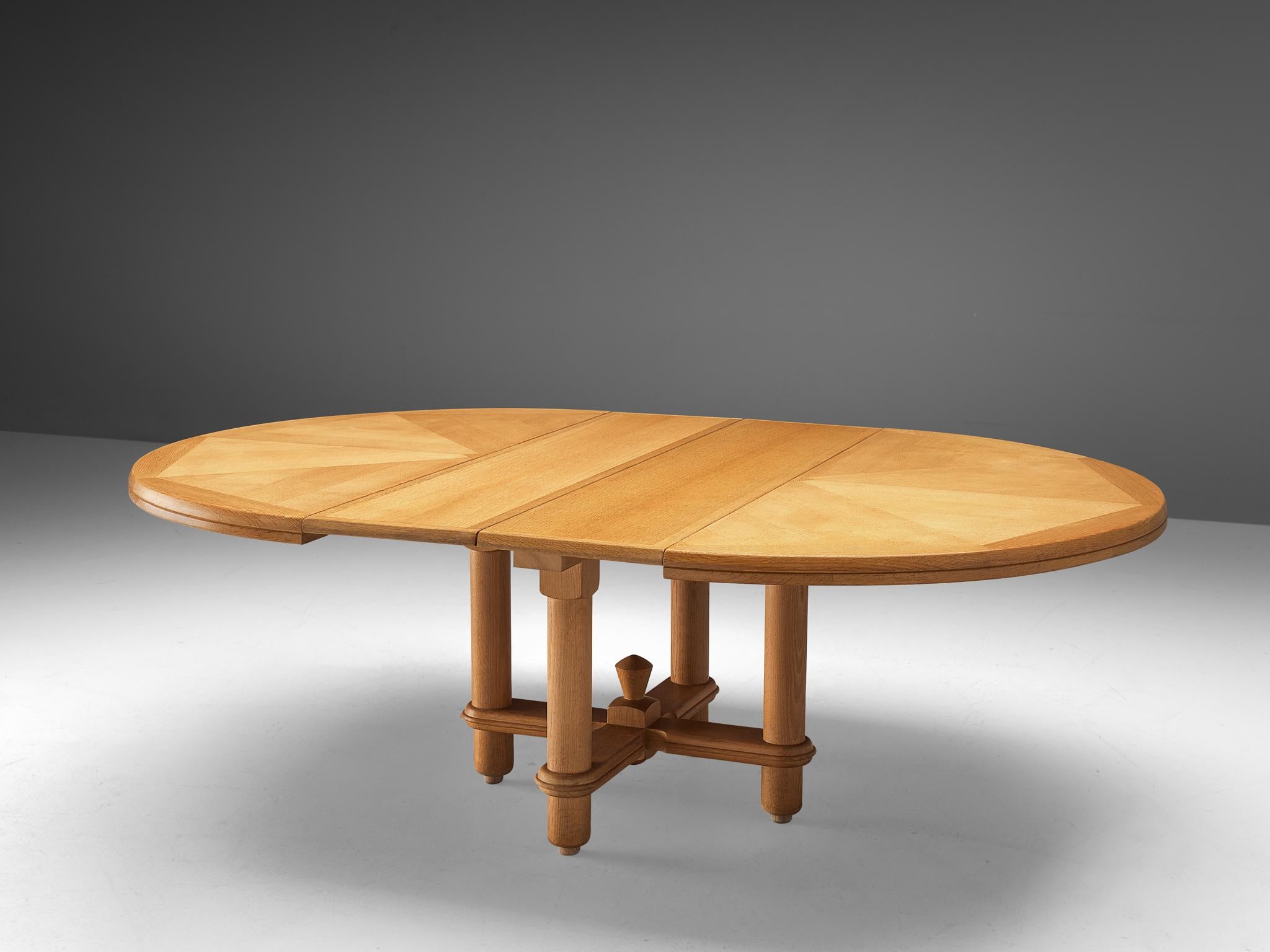 Guillerme et Chambron for Votre Maison, extendable dining table, oak, France 1960s. 

Extendable dining table in solid oak, with beautiful carved wooden decoration, designed by the French designer duo Guillerme and Chambron. The oval top features