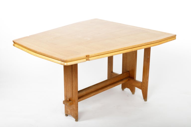 Exceptional Guillerme et Chambron Folding Dining Table, France, circa 1970s.

Handsome design consists of a solid oak construction, exceptional base, and folding table top that can expand as needed. 