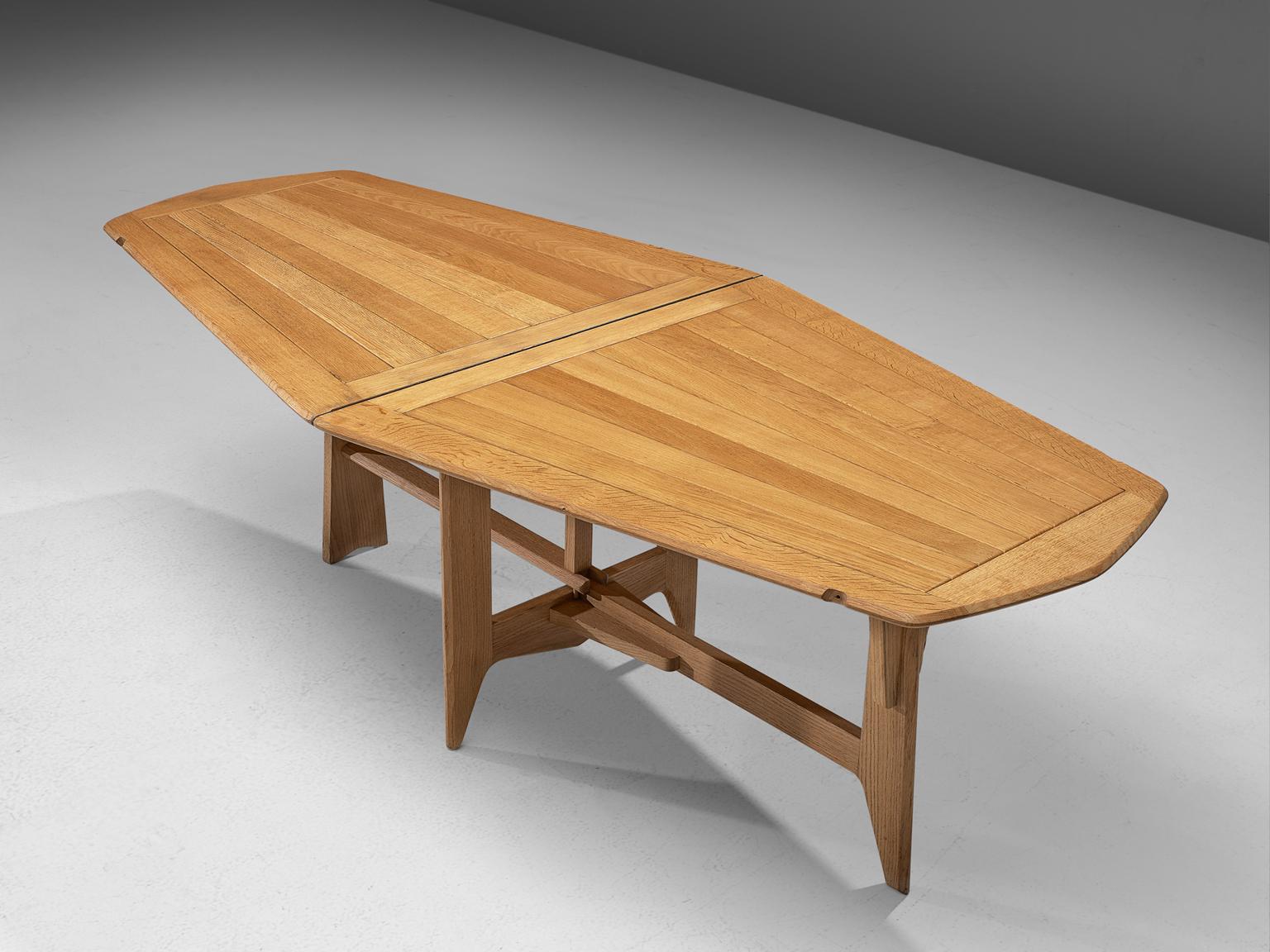 Guillerme et Chambron, table, solid oak, France, 1950s.

Inventive flip-flop table in solid oak by the French duo Guillerme et Chambron. As many of the furniture designed by this duo this piece also shows a strong character. The legs are very