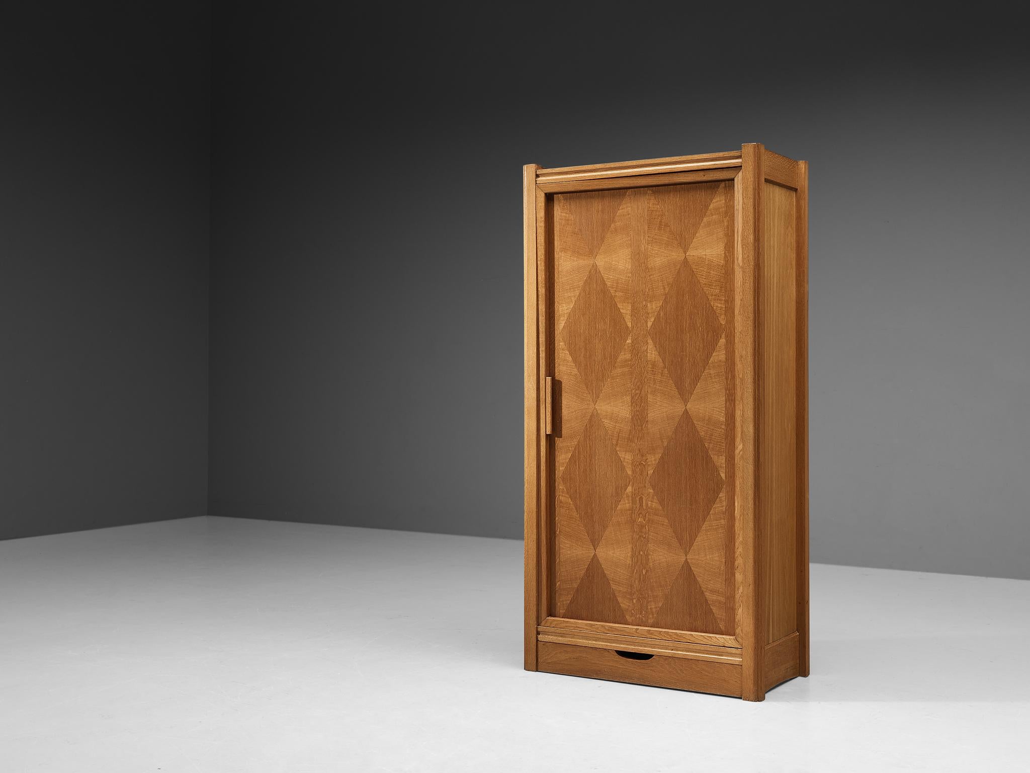 Guillerme et Chambron for Votre Maison, cabinet, oak, France, 1960s

This wardrobe is designed by Guillerme and Chambron and features geometric oak inlays, which is characteristic for the French designer duo. Equipped with one front door panel