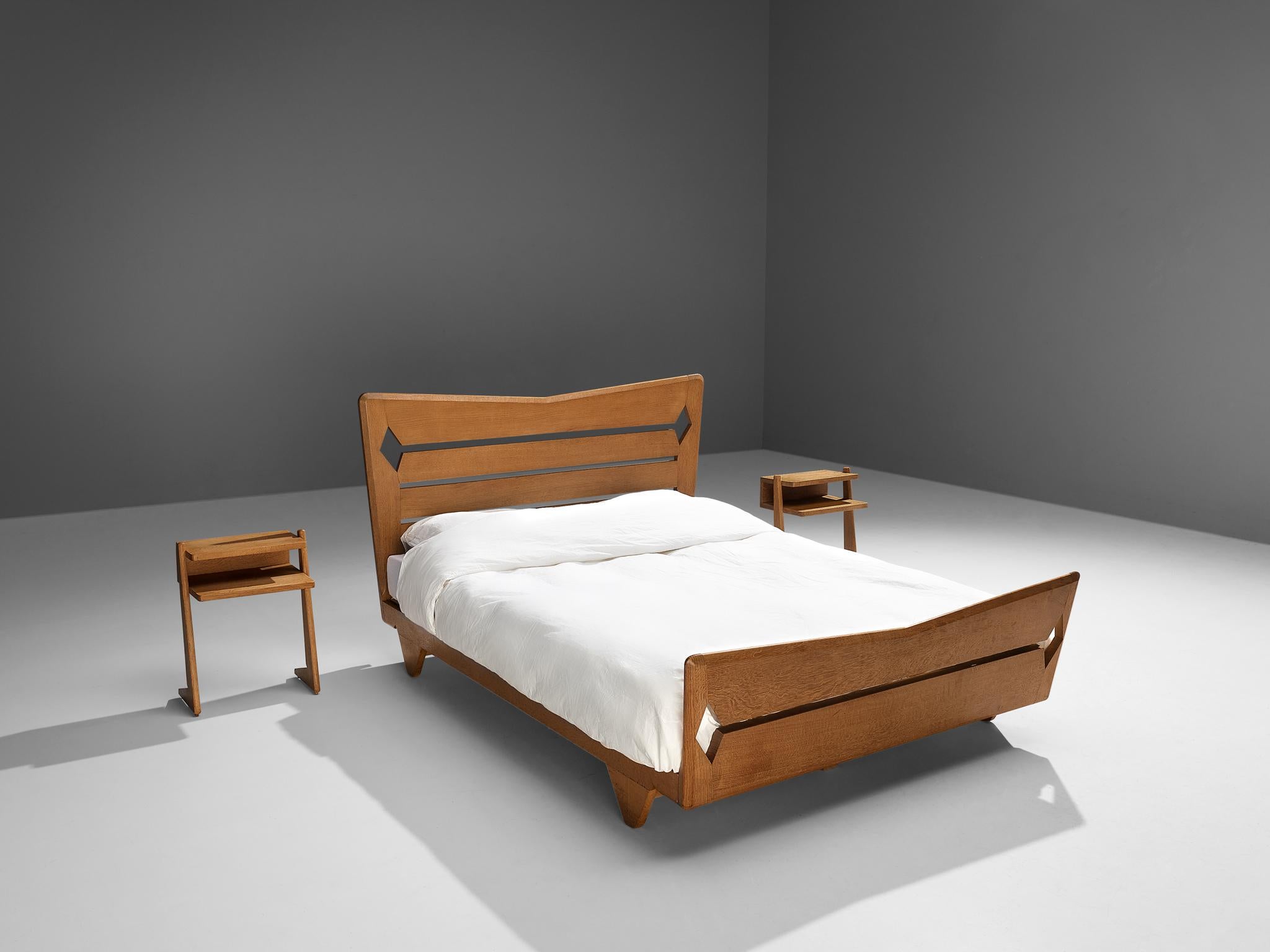 Guillerme et Chambron, double bed with nightstands, oak, France, 1960s

This set's main feature is obvious: It is all about the wood work. The excellent crafted frame has stunning sculpted detailing on the head- and footboard, which gives it a very