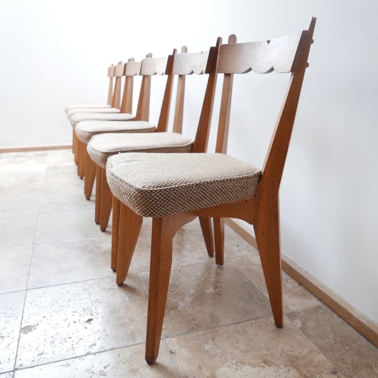 Guillerme et Chambron set of six dining chairs. 

French, midcentury, circa 1960s. 

Original upholstery which is clean and usable but can easily be updated. 

          