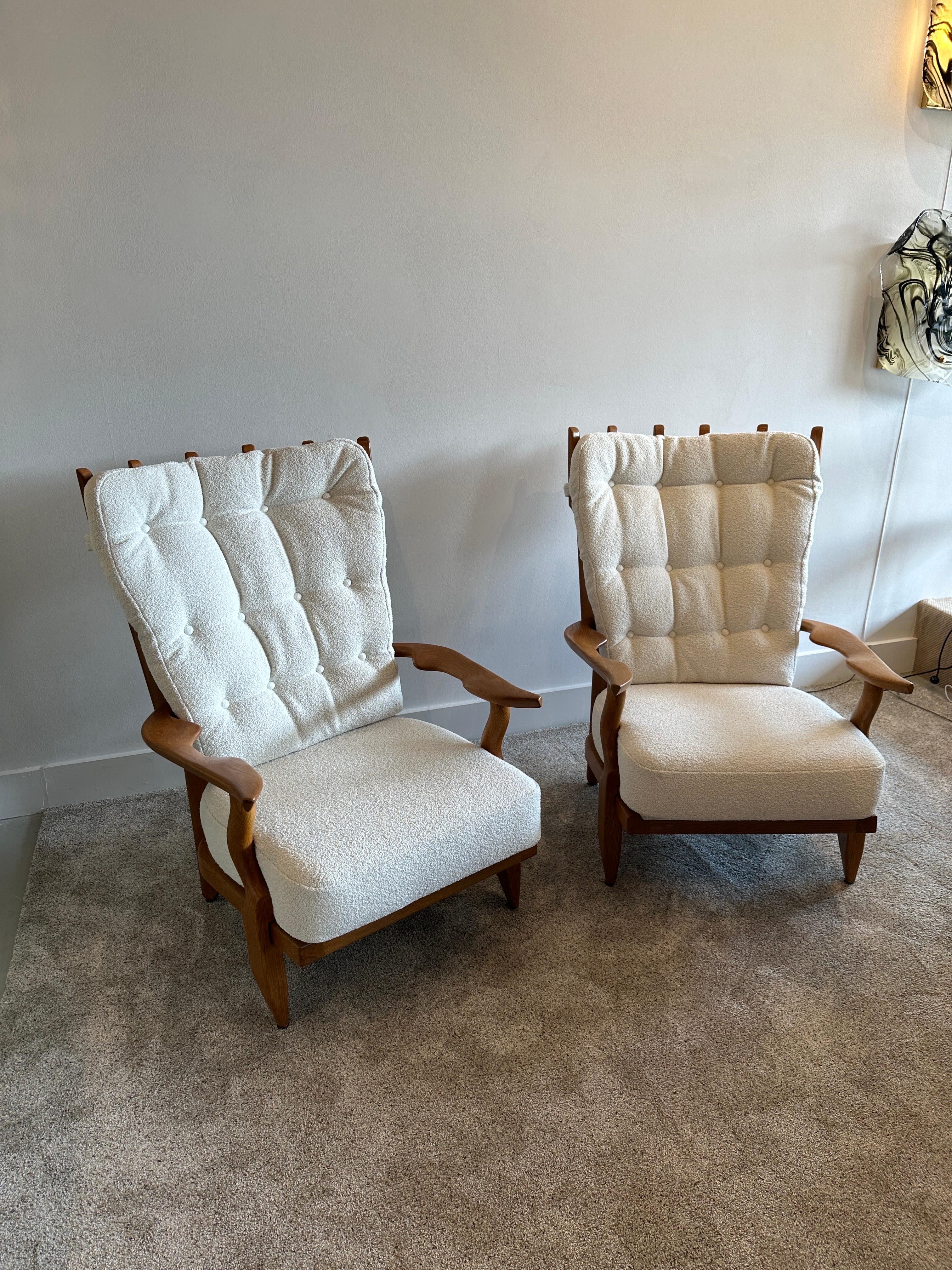 Guillerme et Chambron grand repos armchairs with oak frame and NEW Boucle fabric. Oak frame is solid and newly refinished to its original beauty. 

Robert Guillerme, based in Lille, Northern France, graduated from École Boulle in 1934 where he