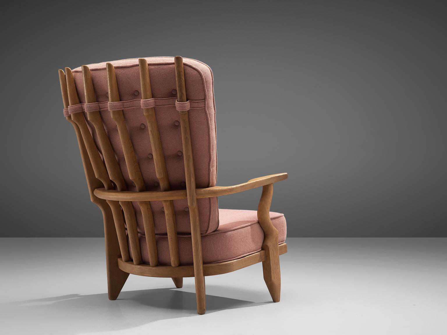 Guillerme et Chambron,'Grand Repos' lounge chair, oak and fabric, France, 1960s. 

Guillerme and Chambron are known for their high quality solid oak furniture, from which this is another great example. This chair with a high back has an