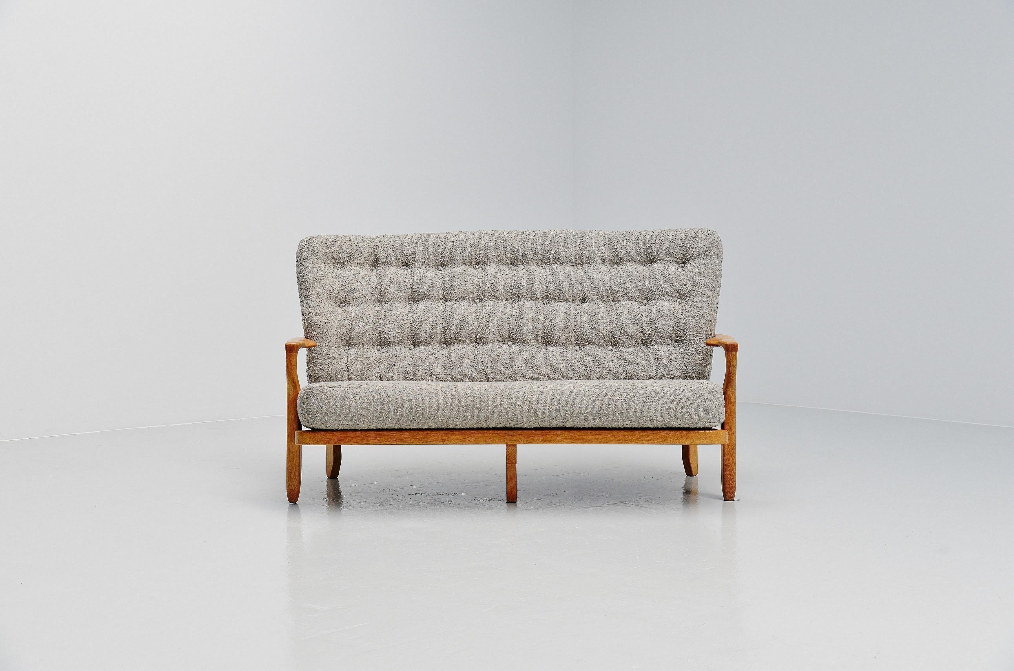 Excellent pair of  'Juliette' sofa's designed by Robert Guillerme et Jacques Chambron, France 1955. These sofas have very nice open structure made of solid oak carved spines, that is what this designer duo was known for. They are newly upholstered