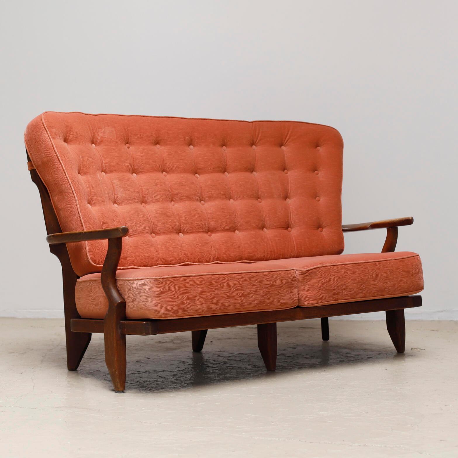 'Juliette' sofa designed by Guillerme et Chambron for Le mobilier Votre Maison in 1950s.
The carved oak frame and the original orange upholstery.
 