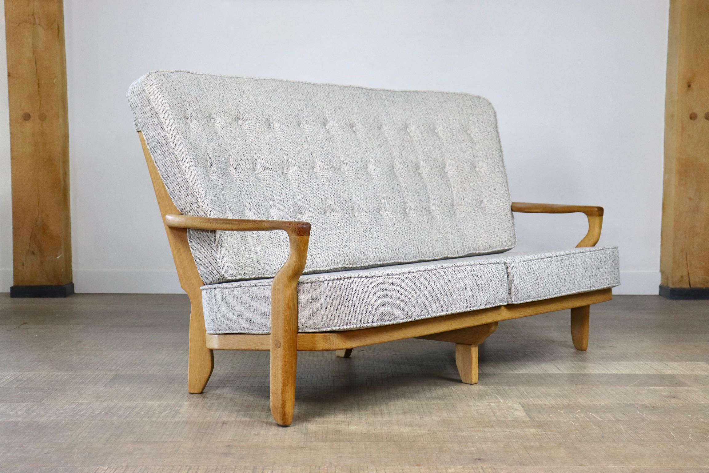 Gorgeous ‘Juliette’ sofa designed by Robert Guillerme et Jacques Chambron, France 1955. These sofas have very nice open structure made of solid oak carved spines, that is what this designer duo was known for. This particular has brand new foam and